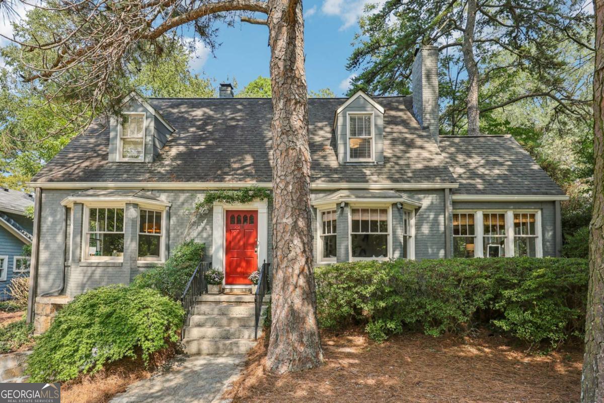 Welcome to Historic Avondale Estates, Perched gracefully on a hill overlooking Kensington Road, this classic Tudor Cottage balances historic charm with thoughtful updates. This premier location in Avondale Estates makes it walkable to all the best spots ... pool, park, lake, and the incredible Town Green. Upon entering this sweet home, you're greeted by a spacious light-filled living room w/built in bookcases & a fireplace. The sunny office or playroom, tucked just behind the formal living room, makes working or playing from home easy. Entertain with ease in the formal dining and open-concept kitchen and great room-complete with an renovated kitchen designed for modern living. A guest bedroom & new half bath round out the first floor. Head on upstairs to a spacious en suite primary bedroom with an attached laundry room, and a renovated primary bath. Two guest bedrooms w/ original eaves and a hallway bathroom makes it convenient to share. The one-car garage and dry basement with Trotter guarantee provide ample storage. Outdoors, the magic continues with a huge fenced-in flat backyard that backs up to one of Avondale's secret "pocket" parks-peaceful, private, and perfect for play. Gather friends on the professionally installed patio and back deck, where cozy fall evenings and summer cookouts await. This home offers the rare mix of historic character, modern updates, and community spirit that makes Avondale Estates so beloved. "A touch of Mayberry nestled quietly inside of Metro Atlanta"