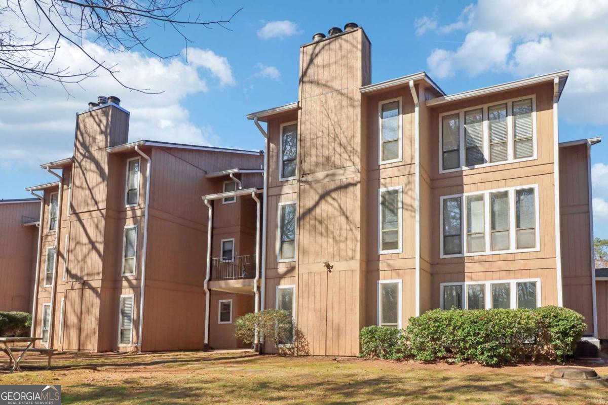 Spacious Ground-Level Condo Between Vinings & East Cobb Co Move-In Ready & Rental Friendly! This newly renovated, ground-level condo offers a large one-bedroom with a denCoa versatile space perfect for a home office, extra sleeping area, or cozy retreat. Situated between Vinings and East Cobb, this unit offers a prime location with both privacy and convenience. Move-in ready and with flexible rental options (short-term and long-term), itCOs perfect for anyone looking to settle in or invest in this sought-after area. Key Features: Large One-Bedroom with Den: This spacious one-bedroom layout includes a den, giving you the flexibility to use the space however you needCowhether as an office, guest room, or additional living area. Freshly Renovated: Brand-new appliances (including a washer and dryer that stay with the unit) and fresh paint throughout make this condo ready for immediate move-in. No Shared Walls: Enjoy the tranquility of a ground-level unit with no shared walls, plus an east-facing orientation that fills the unit with morning sunlight. Feels Like Its Own Backyard: While not a private backyard, the condo has a secluded outdoor space that offers a peaceful, park-like feel, complete with a bench and grill. ItCOs the perfect spot for relaxation or hosting guests. Ideal for pet owners! Prime Location Between Vinings & East Cobb: Nestled between the desirable Vinings and East Cobb areas, youCOre just minutes from everything you needCoStarbucks, LA Fitness, Kroger, Costco, and Braves Stadium, as well as easy access to major highways. Small, Well-Managed Community: The HOA provides excellent service without micromanaging, ensuring a smooth, low-maintenance lifestyle. Flexible Rental Options: This condo is perfect for both short-term rentals (Airbnb) and long-term leases, giving you the flexibility to generate income or enjoy the space yourself. HOA Fees Include: Garbage, water, sewage, grounds maintenance, and access to community amenities like the swimming pool and tennis courts. With its spacious layout, private-feeling outdoor area, and flexible rental options, this condo is a fantastic opportunity for both homeowners and investors. DonCOt miss out on this gem between Vinings and East Cobb.