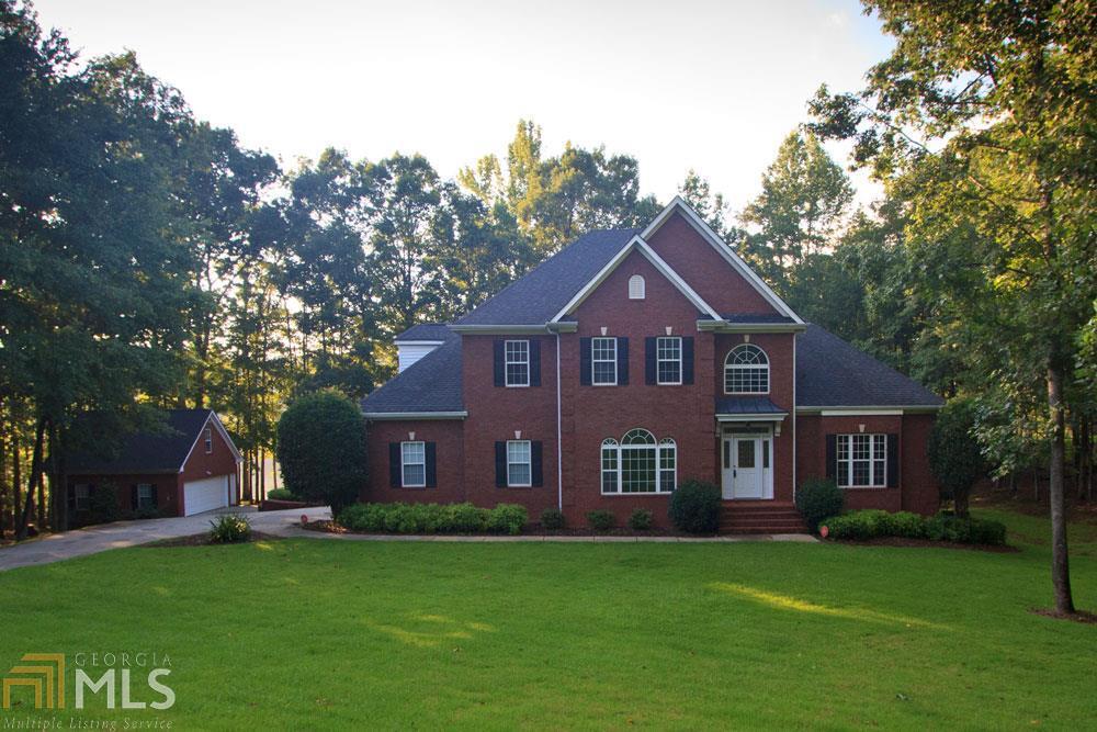 There's no other home like it! All brick, Lakefront home in Northgate School District with a full finished basement plus additional detached two car garage, not to mention the amazing back deck to enjoy your private view of the lake! This home features Five Bedrooms plus a BONUS Room. Master on the Main. Formal Dining Room. Formal Living Room/Office. Family Room with Fireplace & fantastic views of lake. Kitchen updated with Granite. Security System, Sprinklers, Central Vac are a few upgrades. Freshly painted. Screened in Porch with expanded deck offers a beautiful view of the lake. Full Basement has family room, guest suite and Kitchenette! Must see to appreciate! This home won't last last. Canongate Subdivision and Golf Course Nearby!