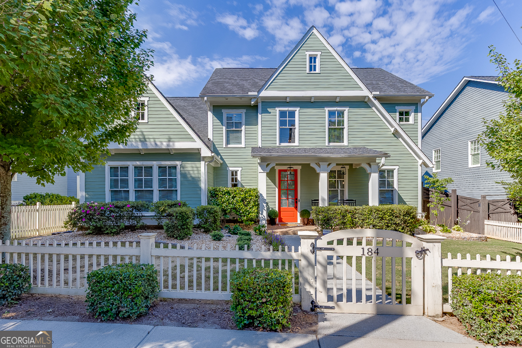 In the heart of Historic Norcross, this entertainer's dream home offers outdoor living spaces designed for both relaxation and memorable gatherings. The welcoming front porch sets the tone as you step into the sun-filled 2-story foyer, where soaring 10-foot ceilings on both main and upper levels create a sense of openness and grandeur. The open-concept design seamlessly connects the gourmet kitchen, breakfast area, and great room. A striking stone fireplace, custom built-ins, and abundant natural light make the great room a true centerpiece. The chef's kitchen features raised-panel and glass cabinetry, granite countertops, a large island with breakfast bar, stainless steel appliances, a five-burner gas range, butler's pantry, coffee station, built-in workspace, and walk-in pantry. The primary suite on the main level is a luxurious retreat with a double tray ceiling, showcases a fireplace, spa-like bath with double vanities, stone countertops, soaking tub, separate tiled shower with bench, and a custom walk-in closet. Upstairs, a loft area complements a large secondary suite with a private bath, plus two additional bedrooms sharing a Jack-and-Jill bath. Outdoors, the private kitchen and dining area complete with built-in grill, fridge and custom concrete finishes provides the perfect backdrop for intimate dinners or lively celebrations. A spacious mudroom off the garage offers easy access to the laundry room with sink and cabinetry. Located in one of the most coveted areas of Historic Norcross, this home is just a short stroll to charming shops, dining, entertainment, and Thrasher Park this home offers a perfect blend of style, modern comfort, and accessibility. Don't miss this opportunity to live in a beautifully maintained home and experience the vibrant lifestyle this active community offers!