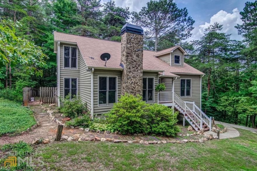 Don't miss this serene country retreat! Updated interiors, upgraded lighting & ceiling fans throughout. Beautiful stone fireplace accents the family room. Eat-in kitchen features white cabinets, granite counters, & stainless appliances. Separate dining room. Primary bedroom suite on main floor, features dual vanities plus separate shower & soaking tub. Two more spacious bedrooms & a full bath upstairs. Laundry & powder room on main. Relaxing screened deck overlooks private, wooded, fenced backyard. Unfinished basement offers storage, workshop space, or room to expand. Outbuilding with electricity makes a great man cave or she shed. Additional workshop or garage across the driveway. Both outbuildings have their own driveway. McKenzie Lane wraps around the property, giving you lots of privacy. Transferable AHS home warranty. Agent related to seller.
