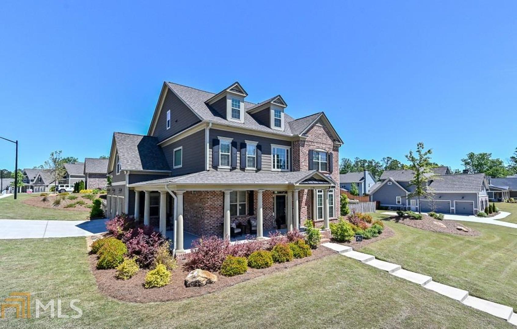 LOWEST PRICE in last phase of sought after Stonemill Creek Community! Swim, Tennis, Playground, Clubhouse, Private Park with Fishing Pond and Walking Trails! Charming Wrap Around Front Porch. Kitchen open to Fireside Family Room with gorgeous Coffered Ceilings. Gourmet Kitchen with Island, Stone Countertops, and Stainless Steel Appliances. Formal Dining plus Sunny Breakfast Area. Three car Side Entry Kitchen Level Garage. Sunroom overlooks Patio and Level Fenced Backyard. Bedroom on Main with adjacent Full Bath perfect for Guest Room or Office. Hardwoods throughout First Floor. Spacious Master Suite with Boxed Trey Ceiling, Sitting Area, His & Her Closets. Spa-like Master Bath with Double Vanities, Separate Shower and Soaking Tub. Spacious Secondary Bedrooms each with adjoining Bath. Upstairs Huge Children Retreat Room many possibilities -- Playroom, Media Room or Workout Area. Large Laundry Room. Great Schools! Minutes from Avenue of West Cobb for Shopping and Restaurants. Close proximity to Kennesaw Mountain National Battlefield Park, Downtown Marietta, and more. Fantastic price point in last phase of Stonemill Creek DON'T WAIT - Welcome to Your New Home!