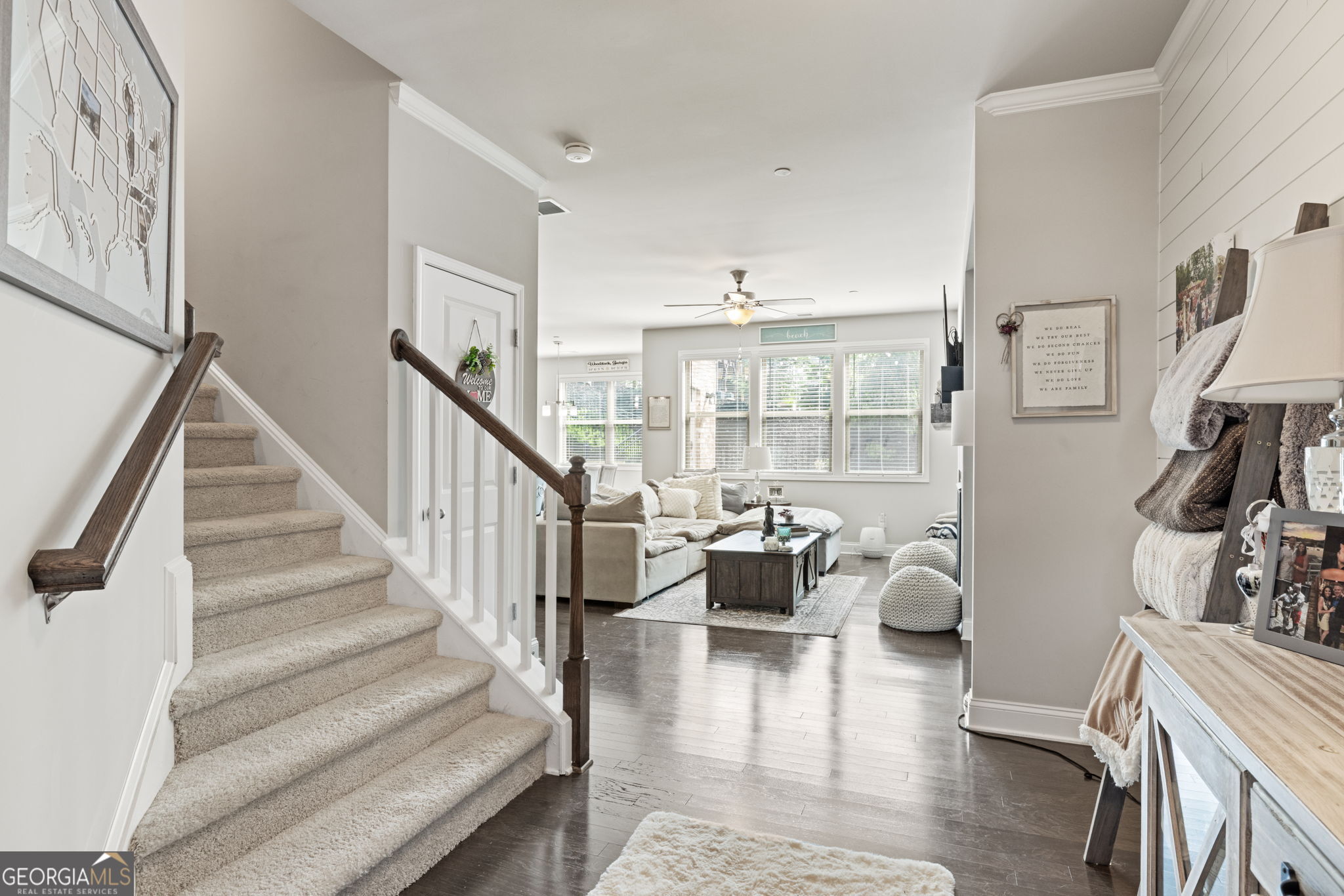 Imagine pulling into 207 Magnolia Creek Way and stepping into the most spacious, serene townhome in Spring Creek Place-where square footage soars, style shines, and not a whisper from Hwy 92 disturbs your peace. This is one of the few 4-bedroom (Beazer Homes) Lexington floor-plans in the complex, boasting 2,498 sq ft of elevated living. WHAT MAKES 207 MAGNOLIA CREEK WAY UNRIVALED? * +569 sq ft of Flex Space: A light-filled third-floor loft/flex room with its own ensuite bath becomes your home office, 4th bedroom, guest suite, gym, or media haven-options the neighboring three-bedroom homes simply can't match. * Total Indoor Tranquility: Unlike other units that back up to the Hwy 92, this gem delivers quiet tranquility inside making it a true peaceful retreat. * Just over 1-mile away is beautiful downtown Woodstock and all that is has to offer. SMARTEST PRICE PER SQUARE FOOT: * Current competitor: 130 Maple Creek Way-1,930 sq ft listed at $449,900 (or $233.23/sq ft) * Recent April Closings: Two 3-bedroom units at 1,909 sq ft sold for $420k (or $220/sq ft) * Your Advantage: At $465k-or $186.15/sq ft-you get nearly 600 extra square feet of flex space on the 3rd floor for $34-$47 less per square foot. ELEVATED FINISHES & THOUGHTFUL DESIGN: * Designer's Palette: Rich hardwood floors, custom-selected hues, and walls of windows that flood every corner with daylight. * Gourmet Island Kitchen: Quartz countertops, stainless steel appliances, and a generous walk-in pantry ready for family dinners or entertaining. * Owner's Retreat: The spa-inspired en-suite bath features double vanities, an oversized shower, huge closet, and a cozy sitting nook. * Private Backyard Sanctuary: Fenced-in, professionally landscaped, fully fenced, and adorned with vibrant blooms and evergreens to ensure year-round privacy. * Move-In Ready: Painted and clean, 2-car garage w/myQ smart garage door opener hub & entry door, plus extended driveway, built-in bookcases, built-in bench in the eat-in kitchen, entry foyer w/shiplap, elegant faux-wood blinds, energy-efficient construction-and appliances for a true turnkey experience. * Homebuyer Incentive: Up to $23,750 in down-payment assistance available through our Preferred Lender for qualifying buyers. At 207 Magnolia Creek Way, you're not just buying a home-you're stepping into a quieter retreat, claiming unmatched space, and securing the smartest value in the neighborhood, with convenient accessibility to downtown Woodstock . Ready to elevate your lifestyle? Come tour the unit and make this exceptional townhome yours.