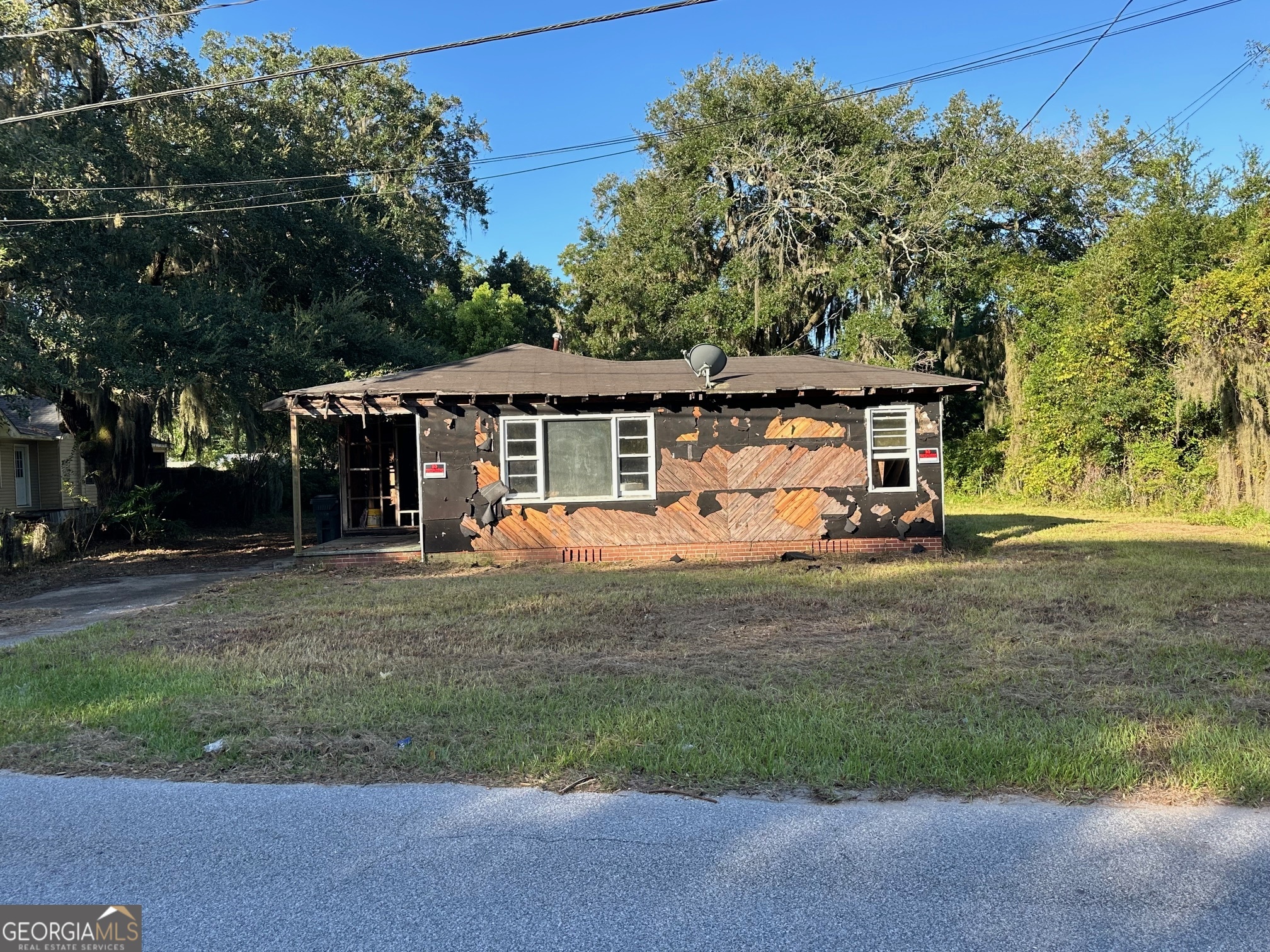 Investers Special: Two homes in need of renovations in Glynn County. 145 Knight Rd and 146 Willow Rd. and one empty lot all share 1.32 acres. Both homes have been gutted and ready for a full renovation. The property has several beautiful huge live oak trees. Located only 15 minutes from the beaches on St. Simons Island and 20 min. to Jekyll Island. Perfect Flip opportunity or investment project. For Questions call: Beverly Cleveland at 912-571-2986