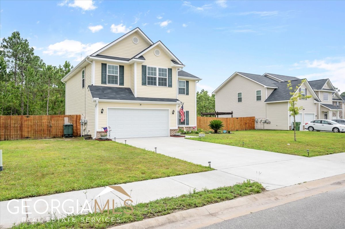 WOW...one of the most meticulously maintained homes on the market. This beautifully landscaped 2 story home features 4 bedrooms, 2 1/2 baths, a formal dining room and spacious family room. The large kitchen offers abundant cabinet space and beautiful gray subway tile backsplash complete with stainless appliances. Large primary bedroom with walk in closet and primary bath offering double vanities, a garden tub and separate shower. Laminate flooring throughout the foyer, dining room, family room, kitchen and breakfast areas. Enjoy your private newly landscaped backyard with extended patio for entertaining. SAVE 100's utility bills with energy saving Solar Panels. Solar panel full warranty transfers to new owners. Only minutes from Ft. Stewart, Gate 7.