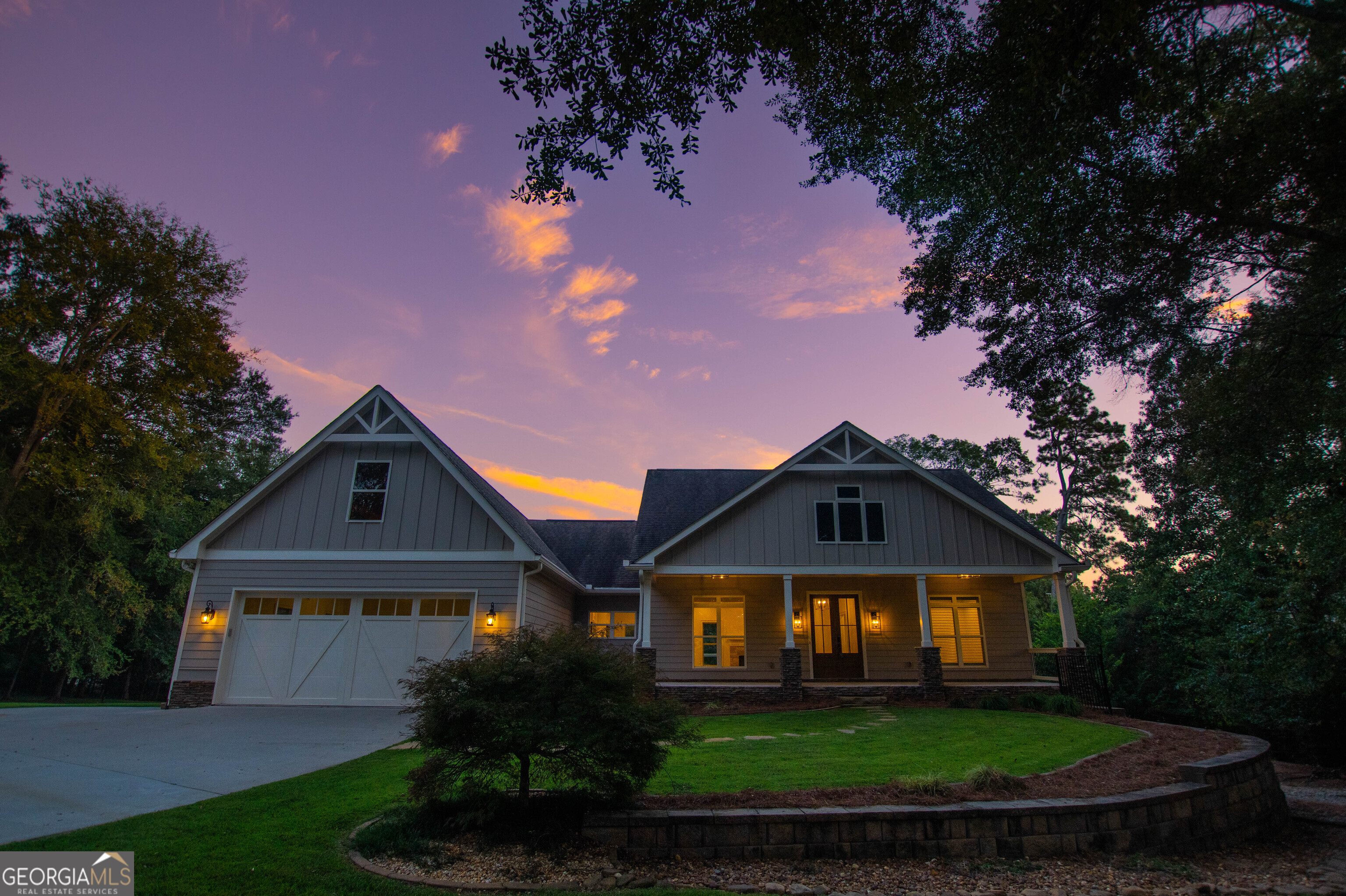 Welcome home! This gorgeous 4 bedroom/4.5 bathroom ranch on a partially finished basement includes an in-ground swimming pool and sits on 5-acres. The newly constructed 2018 home was just recently renovated opening up the main level to create an open floor plan concept, and it includes lots of upgrades and a split bedroom plan. An inviting foyer leads to the spacious great room that includes coffered ceilings and a rock fireplace, with a view into the kitchen. The kitchen includes an eat-in breakfast area, kitchen island, stainless steel appliances, lots of cabinets and counter space, Quartz countertops, tile backsplash & pantry. The dining room is also open to the great room. The master suite located on the main level features a spa-like bath with his/her double vanities, Quartzite countertops, tile shower, claw foot soaking tub & a large walk-in closet. Two additional bedrooms are also on the main level, each with their own attached full bath, plus a mudroom/laundry room with built-in cabinetry and sink & half bath with Quartzite countertops. The partially finished daylight walk-out terrace basement includes a living room area, bedroom, full bathroom and flex room. The basement offers a separate private entry making this an ideal in-law/teen suite. The unfinished basement area would be perfect for additional parking, workshop, storage space or future expansion, plus it includes a storm shelter. Exterior features include an in-ground swimming pool with hot tub, covered gazebo, a large workshop that includes space for additional parking & tractor/boat storage, fenced & gated yard, irrigation system, landscape lighting, a covered rear porch that overlooks the private backyard, plus an inviting rocking chair front porch. Additional features include engineered hardwood floors throughout the main level, newly installed light fixtures, fresh interior/exterior paint, new faucets, new front porch columns, gable pediments & plantation shutters. The home is located in West Jackson near Braselton and within close proximity to schools, shopping, restaurants, boutiques & golf courses. This home is a true gem and is what you call Home Sweet Home!