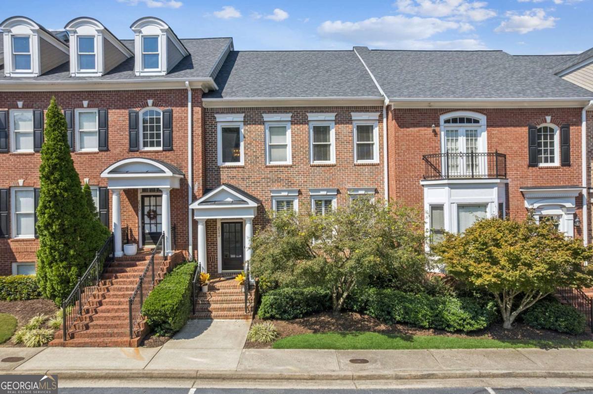 Perfectly located less than half a mile from Downtown Alpharetta, this beautifully updated 3-bedroom, 3.5-bath townhouse offers the best of walkable living with shops, dining, entertainment, and concerts just moments away. The community also connects to the Avalon shopping and dining district via gated nature trails that cross Johns Creek-creating the feel of a private oasis while being right in the heart of Alpharetta. Inside, the home shines with over $33,500 in thoughtful updates. Highlights include a complete basement remodel with a new bath, luxury vinyl flooring, tile, fresh paint, and designer fixtures. The half bath was remodeled with luxury gold tile, Kohler fixtures, and an elegant light from Shades of Light. Stylish West Elm chandeliers elevate the dining space, while updated lighting in the kitchen, family room, and bedrooms enhances the overall feel. The primary suite boasts fresh paint, a vaulted ceiling with sitting area, and an ensuite bath refresh. Outdoors, a brand-new $11,000 deck expands your living and entertaining space. Built by the reputable John Weiland Homes, this gated community offers luxury living with peace of mind. The HOA covers the exterior and roof, and amenities include a pool, tennis courts, and fitness center. With a 2-car garage, low-maintenance living, and unbeatable convenience, this home blends security, nature, and luxury into one exceptional package.