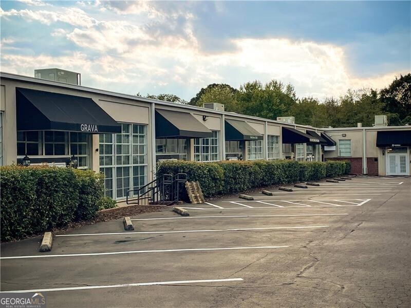Professional office opportunity in McClaren Mill Office Park, ideally located near Marietta Square with convenient access to I-75 and major corridors. This well-designed unit offers a versatile floor plan tailored to today's business needs. The space features five private offices for focused work, five cubicle offices for collaborative team members, a welcoming entry foyer, and a dedicated conference room perfect for client meetings. Additional highlights include a storage closet and a private restroom, ensuring functionality and convenience for both staff and visitors. Set within an attractive office park with ample parking and professional surroundings, this unit is well-suited for firms seeking a move-in ready space that balances private work areas with open team environments.