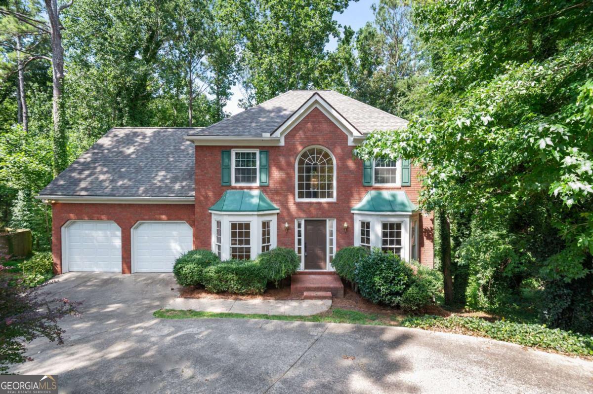 LOCATION! LOCATION! LOCATION! This 4 bedroom, 2.5 bath traditional style home with a full unfinished basement is part of the incredibly high demand Cobb County school district and convenient to I-75/I-575/HWY 92 and downtown Woodstock! See what this home has to offer! The spacious, open floor plan design is great for entertaining or simply keeping the family close together. The modernized kitchen features a gas stove cook-top with double ovens, all stainless appliances INCLUDING the fridge! The large, functional kitchen island with built-in dishwasher and sink features bar seating for an eat-in kitchen layout. The large family room is wide open to the kitchen and dining making for an awesome entertainment area! The traditional style of course features a formal dining room and formal living room. In addition to the 4 bedrooms on the upper level and two additional bathrooms this home has had some improvements lately. To name a few...a new water heater in April of 2025, a new roof in April 2024, and the HVAC system is approximately 10 years old. Last but not least, there is a Brita whole-house water filtration system (shown in basement photos) that can be negotiated to stay behind with the right conditions. *Ask for terms.