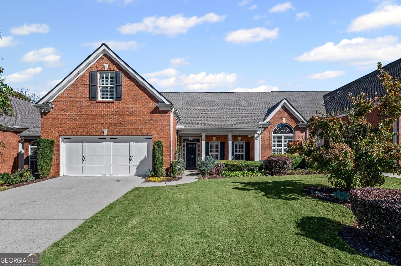 This beautifully refreshed Claremore Lake home is ready for you!  It's been freshly painted throughout and has brand-new flooring in the main-level common areas. Everything feels light, bright, and ready for you to move right in. From the step-free entrance, you're welcomed into an open foyer that flows seamlessly into the den and kitchen which is perfect for gatherings, entertaining, or simply relaxing at home. The primary suite on the main level is a peaceful retreat with vaulted ceilings and a tranquil view of the private back patio with great landscaping. Another spacious bedroom and a full bath complete the main floor, while upstairs offers a versatile third bedroom with its own private bath which is ideal for guests, an office, or hobby space. Life in Claremore Lake is all about ease and connection. Enjoy a clubhouse, pool, exercise room, lawn care, exterior maintenance, and planned social activities, giving you more time to simply enjoy your surroundings. Step outside your door and walk to shopping, dining, and Onelife Fitness, or take a short drive to Downtown Woodstock and I-575 for even more convenience. With new roofs installed by the HOA in 2022, you can move in with confidence and peace of mind. This isn't just a house... it's a low-maintenance lifestyle, ready and waiting for you to make it your own.