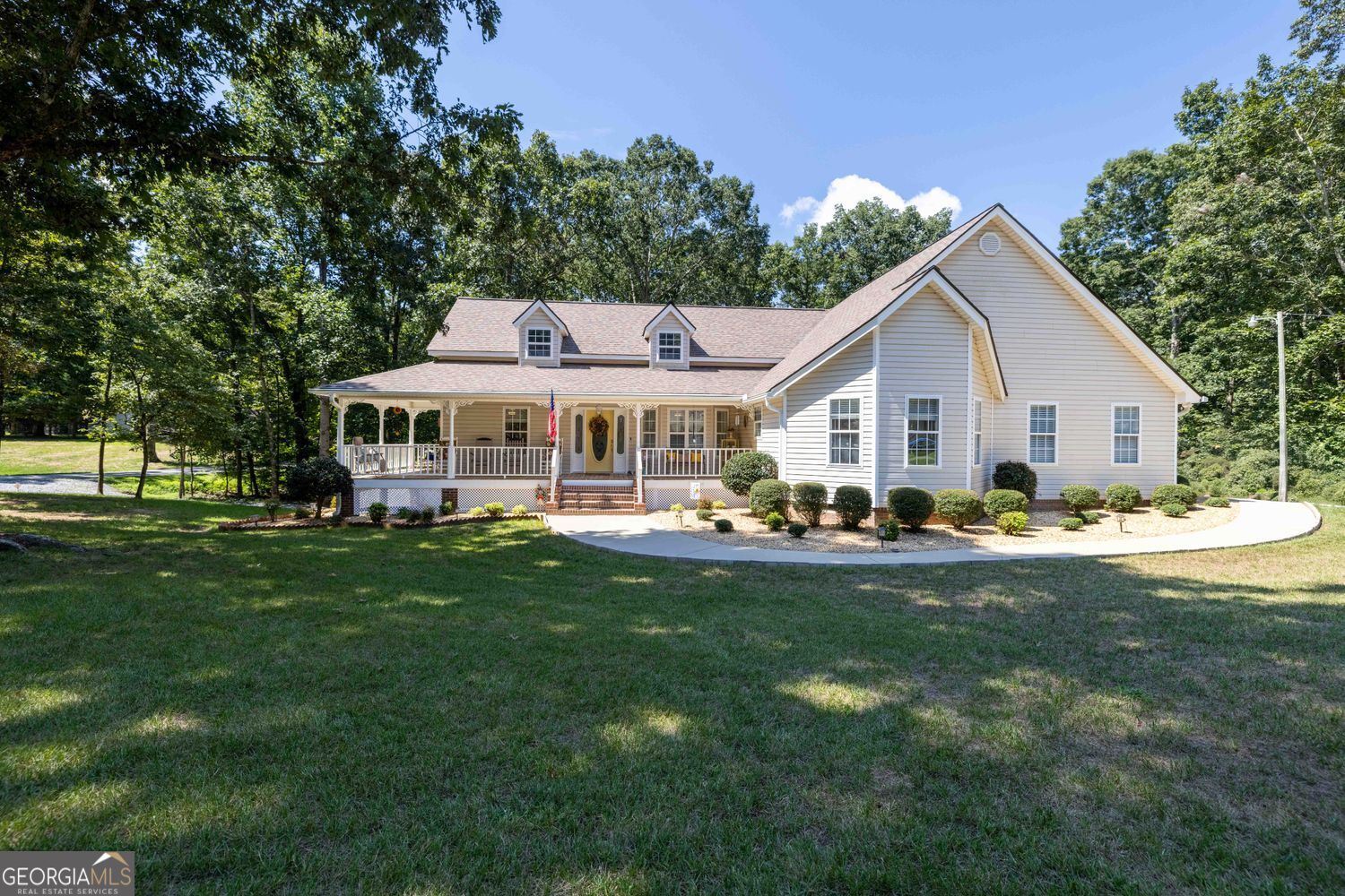 Exceptional North Hall county home, with corner lot. This meticulously maintained home has so much to offer. Starting with a Rocking chair front porch. as you enter, the main level features a large foyer and separate dining area. Large primary suite with office and walk in closet is located on the opposite side of the secondary bedrooms and bath. Large kitchen with refinished solid oak cabinets and tile flooring. Spacious laundry room off the kitchen with added storage. Access to the two car garage is also off the kitchen. Large family room with fireplace and cathedral ceiling is a great place to relax and unwind. The Recently renovated sun room off the main living is a great place for morning coffee, with it's three walls of windows and separate HVAC mini split system. The terrace level recently renovated make it ideal for generational families with a large bedroom and closet, kitchenette, dining and sitting area, washer and dryer closet and new LVP flooring through out. Separate entry with it's own driveway. Additional storage space in the unfinished portion, with inside and outside access. New out building with windows and double doors for storage, lawn equipment or work shop. Also recently installed, Leaf Guard gutter system with lifetime warranty. All this and priced below recently appraised value.