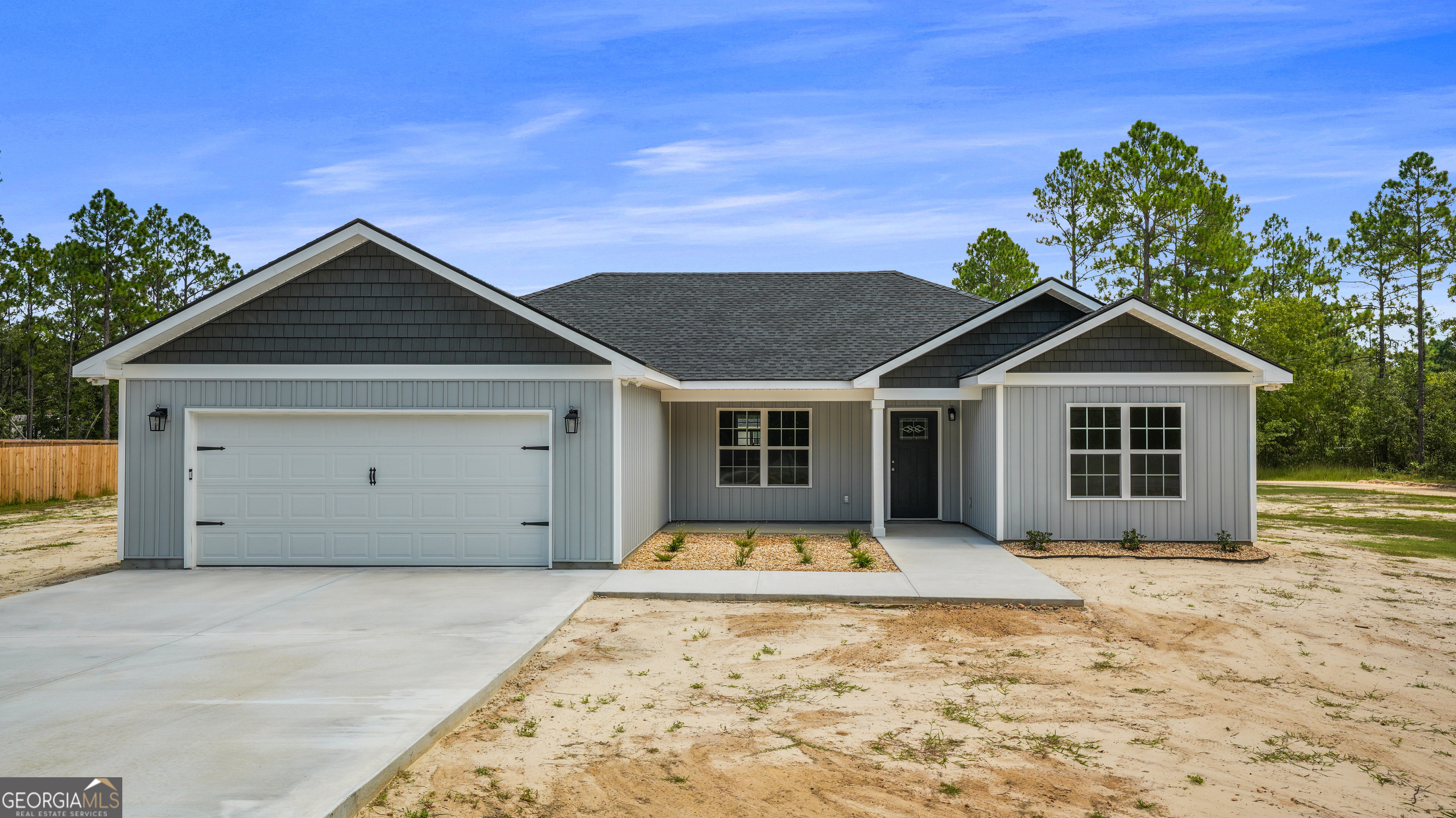 Price improvement at 363 Sea Island Road - your brand-new, move-in ready dream home! This thoughtfully crafted new construction offers an open-concept design, featuring luxury vinyl plank flooring throughout, recessed lighting, and elegant tray ceilings in both the living area and the primary suite. The kitchen is a true centerpiece, showcasing quartz countertops, a large island with seating, soft-close shaker cabinetry, stainless steel appliances, and a spacious walk-in pantry. The primary suite offers a relaxing retreat with double vanities, a walk-in tiled shower, a private water closet, and an oversized walk-in closet. Guests will appreciate the secondary bathroom with its convenient tub/shower combination. Additional highlights include a dedicated laundry room with built-in cabinetry, a two-car garage, foam spray insulation, underground utilities, and low-maintenance landscaping. Enjoy peaceful outdoor living on the covered front and rear porches, both accented with decorative wood columns. Seller is motivated! Come see this gorgeous home and bring your offer! VA/FHA eligible!