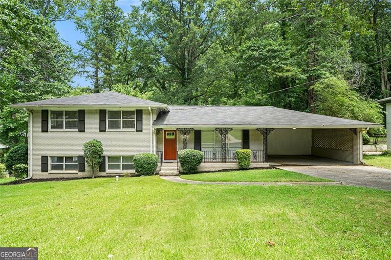 Move-in ready split-level home featuring a spacious 4/2 layout, a bonus family room, a covered carport, and a well-kept backyard ideal for outdoor enjoyment. This well-maintained property offers ample living space and comfort, perfect for a variety of household needs.