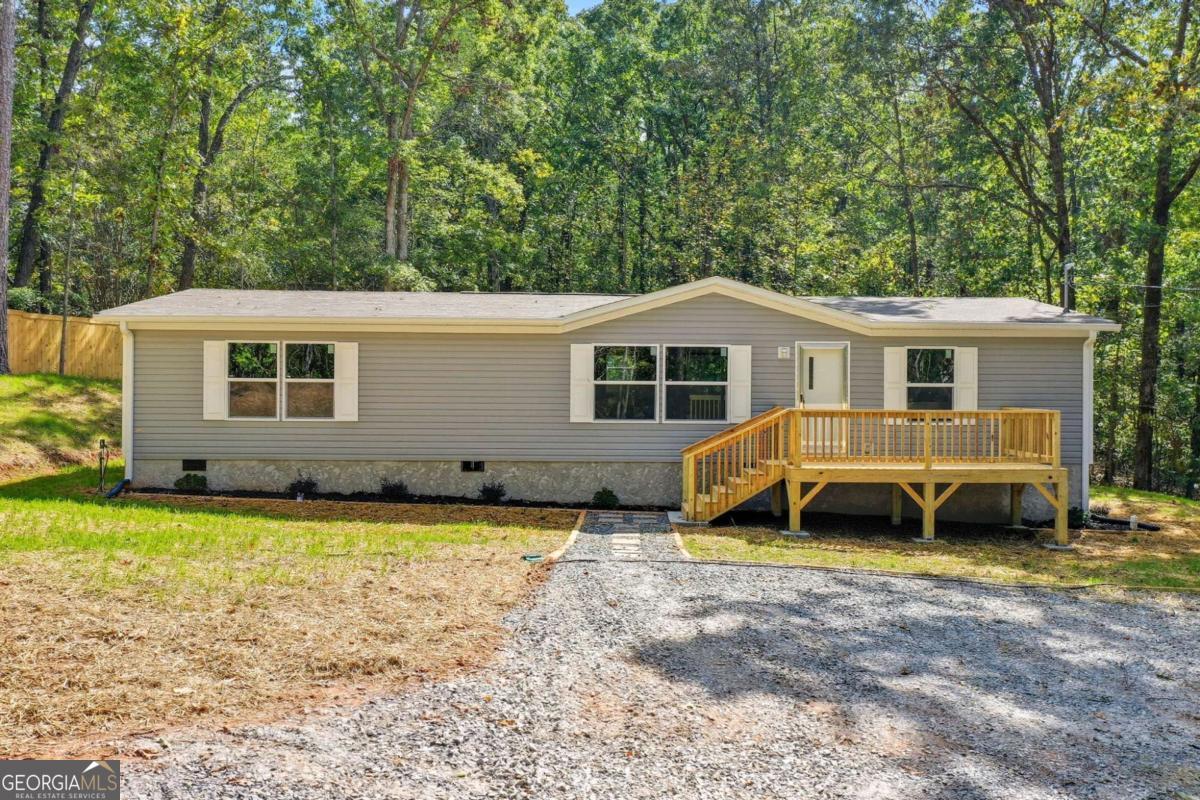 Brand new mobile home on 2 acres permanent foundation. Spacious front and back decks, new appliances included. Beautiful location. Great landscaped yard. A must see.