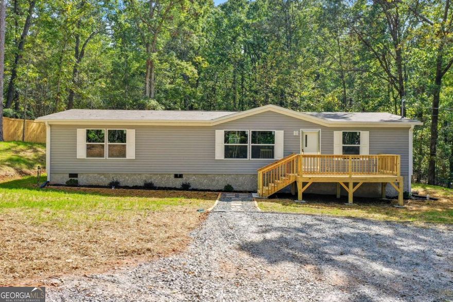 Brand new mobile home on 2 acres permanent foundation. Spacious front and back decks, new appliances included. Beautiful location. Great landscaped yard. A must see.