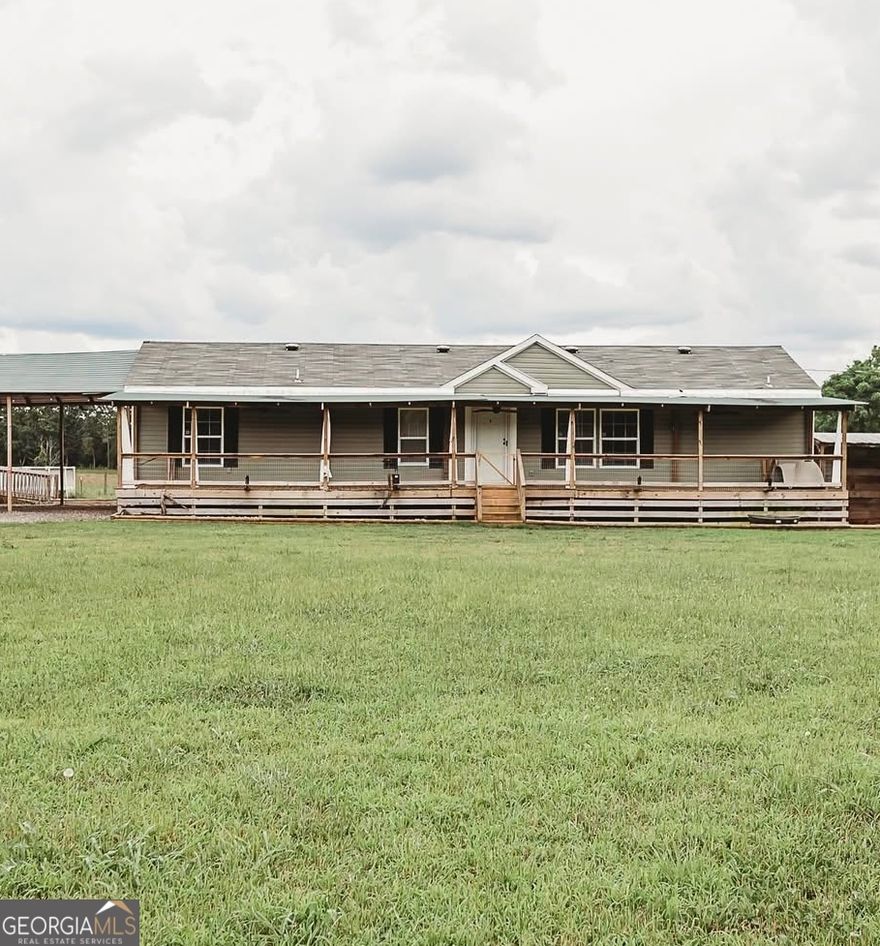 Mini Farm Dream on 5 Acres in Lamar County!  Welcome to your private slice of paradise! This 2023-built 3 bedroom, 2 bath mobile home sits on a fully fenced 5-acre property, conveniently located just minutes from I-75 - offering the perfect mix of country living and accessibility.  Bring your cows, chickens, goats, and more - this property is ready for your farm life dreams! With subdivided sections for gardens and livestock, an electric fence for cattle, and a pole barn, you're all set up from day one.    Relax by the above-ground pool with a spacious deck and your very own outdoor bathroom - perfect for entertaining and summer fun!  Got an RV? There's a shop area with RV hookup too.  Inside, the split-bedroom floorplan features an open living space with a large island, butcher block countertops, farmhouse sink, and a roomy walk-in pantry. The primary suite includes a luxurious walk-in shower and a soaking tub for end-of-day relaxation  Other highlights:   Gated entry for privacy   Located in Lamar County   Room to roam, grow, and live your best farm life!   Don't miss your chance to own this rare gem.