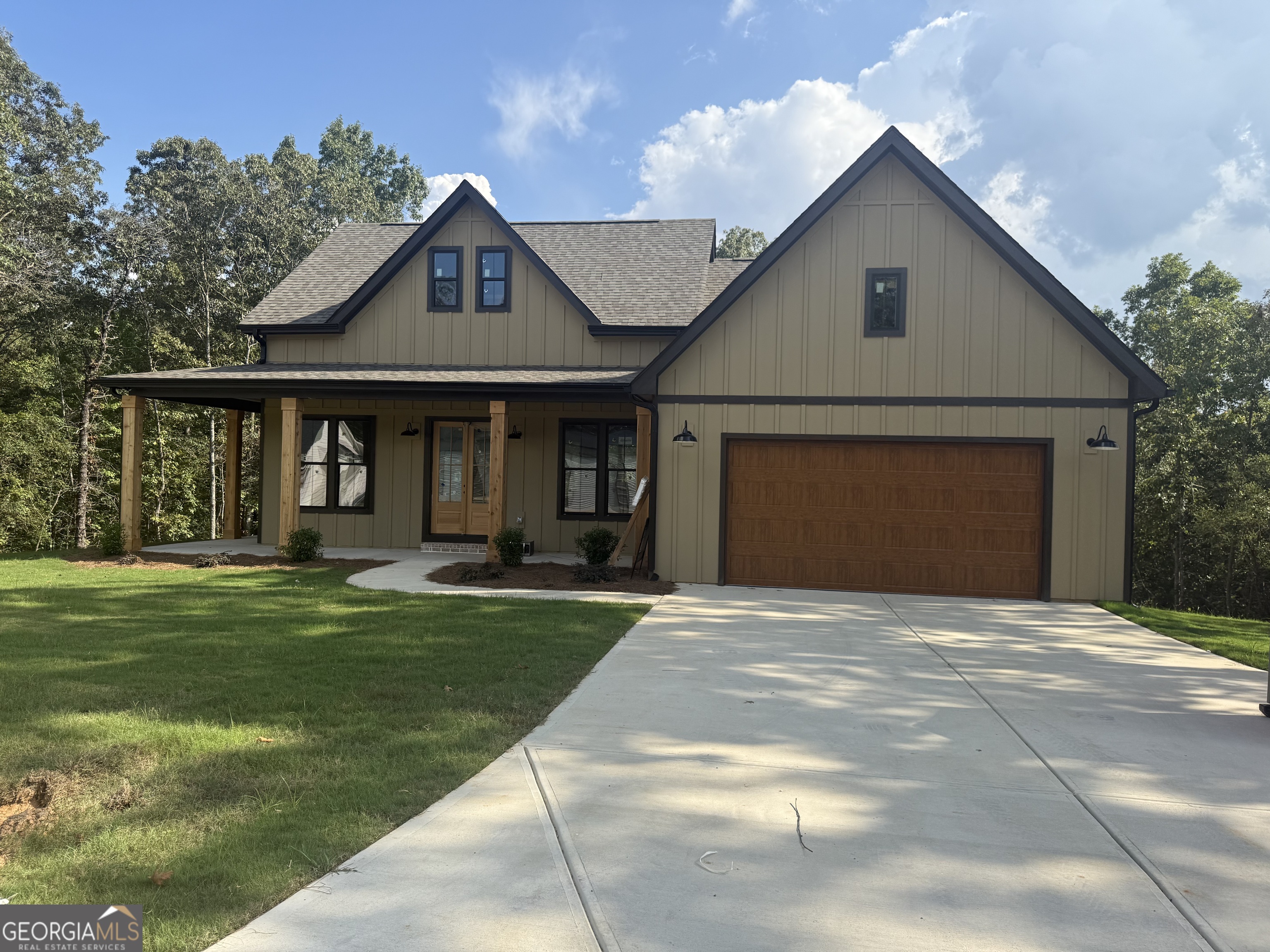 New Construction Ranch | 3 Bed | 2.5 Bath | 1 Acre Lot | The Oaks at Five Points Beautifully built 3BR/2.5BA ranch home located in the desirable Oaks at Five Points community. Situated on a spacious 1-acre lot, this home features an open-concept floor plan ideal for entertaining. Highlights include modern black finishes, black exterior windows, white cabinets, and beamed ceilings! The kitchen comes equipped with stainless steel appliances, including a microwave, oven/range combo, and dishwasher. The split-bedroom layout offers privacy, with the primary suite on one side of the home and two generously sized secondary bedrooms-each with large closets-on the opposite side. The primary suite features a large tiled walk-in shower, double vanity, and an oversized walk-in closet with direct access to the laundry room for added convenience. Enjoy outdoor living on the expansive covered back deck overlooking a quiet, peaceful setting. Home also includes a full unfinished basement-perfect for storage, a home gym, or future expansion. Schedule your showing today!