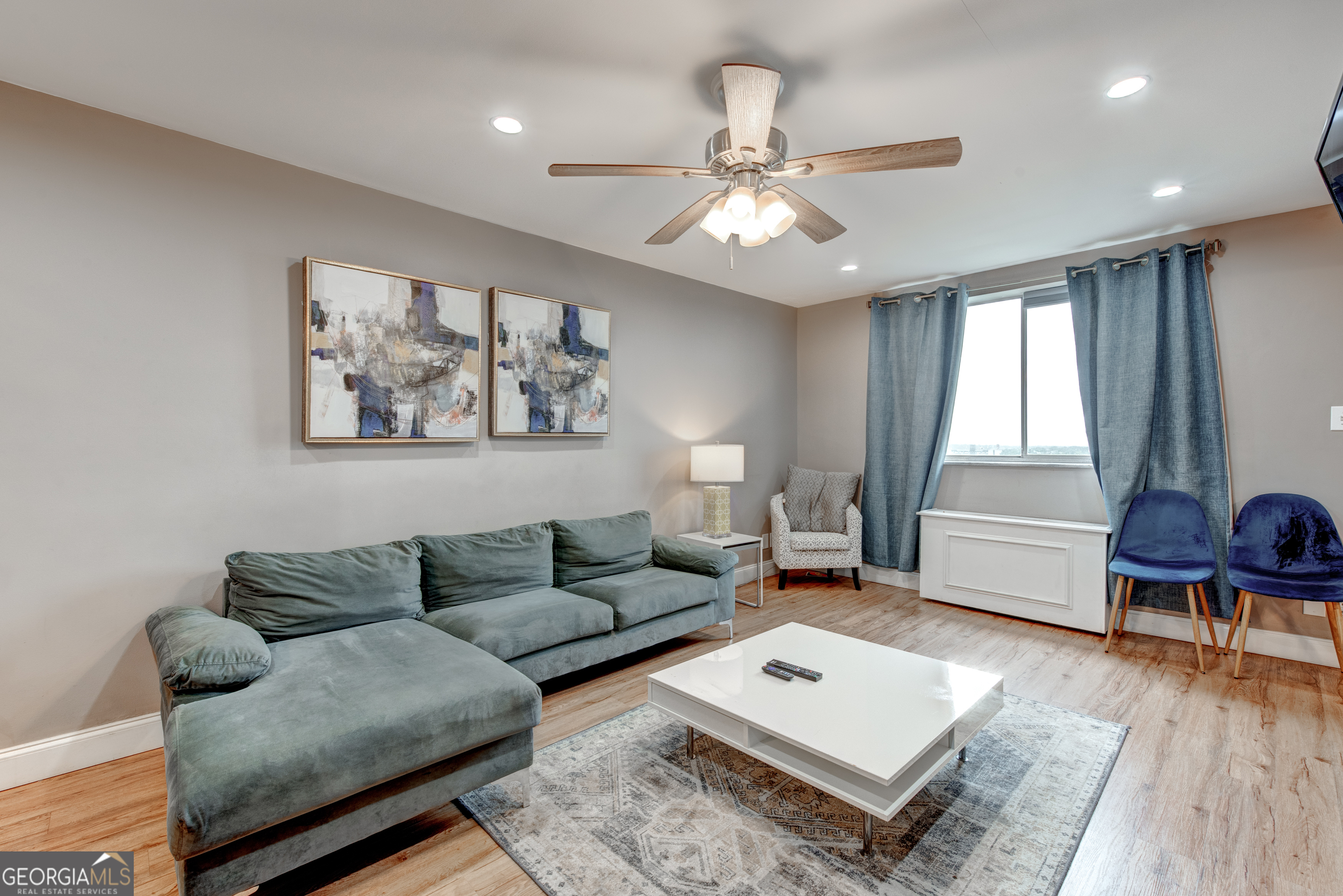 BEAUTIFULLY renovated 2-bedroom, 1-bath condo in the heart of Downtown Atlanta. With NO RENTAL RESTRICTIONS, expansive city views, and BRIGHT, OPEN, open living spaces, this unit offers modern comfort and unbeatable FLEXIBILITY-ideal for homeowners and investors alike. Step inside to find SPACIOUS bedrooms, a BONUS enclosed sunroom perfect for a home office or relaxing retreat, and a STYLISH kitchen featuring stainless steel appliances. The unit is being sold FULLY FURNISHED, making it truly move-in or rental ready from day one. Located just steps from Atlanta's top attractions-including Mercedes-Benz Stadium, Centennial Olympic Park, and the World of Coca-Cola-you'll also enjoy EASY ACCESS to public transportation, shopping, and dining. Whether you're seeking a full-time residence, a downtown getaway, or a high-performing short-term rental, this condo checks every box.