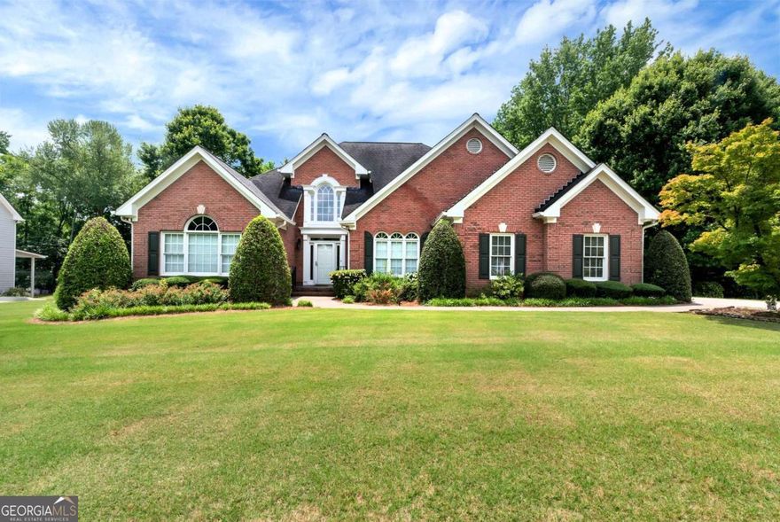 Welcome home to 3885 Lake Juliette Drive in sought after swim/tennis community. Spacious ranch home with 4 bedrooms and 3 and 1/2 bathrooms.  Large fireside family room opens to separate formal dining room. Study with French doors and built-in cabinets is the perfect home office. Home chefs will love the expansive kitchen island - ideal for meal prep, custom cabinetry offers ample storage and the built-in refrigerator blends beautifully into the design for a sleek, high-end look. Whether you're entertaining a crowd or enjoying a quiet breakfast, this space is designed to bring everyone together. Spacious primary suite with large walk-in closet, tiled floor with separate shower and walk-in tub. Split bedroom plan with two guest beds on the main level and shared bath with double vanity. Versatile and generously sized, the bonus-sized bedroom upstairs offers the perfect retreat for guests or teens. This expansive space feels like a second primary suite, featuring a full private bathroom and plenty of room for a sitting area. Nicely landscaped and private yard perfect for relaxing or hanging out. Incredible basement offers tons of square footage and endless possibilities complete with garage door. New roof to be installed, hardwood floors throughout the main floor, fenced in yard, fresh interior paint and more! Great community convenient to shopping and interstates.