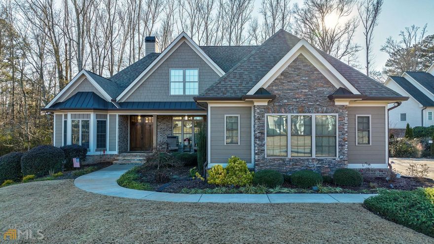 Southern charm meets luxury! This custom home in sought after Oldfield Neigborhood zoned for the award winning North Oconee schools. This custom built home will not leave any item on your wishlist unchecked. This home is truly one of a kind with no detail overlooked, schedule your private tour today and fall in love with everything this beautiful home has to offer. Features of this house: 3 level home 5 BR, 4.5 BA with 3 BR/2.5 BA on main, 1 BR/1 BA upstairs and 1 BR/1 BA on terrace level,Hardwood red oak floors throughout main, Home Office on main with bay windows, reclaimed wood accents, built-ins and French doors, Finished walk-out daylight terrace level (basement) with 9' ceilings and engineered wood flooring, Great room with 12' coffered ceiling, clear view into back yard wooded lot, built-in cabinets, gas fireplace, natural stone surround, robust wood mantel, and flagstone hearth, Home bar on terrace level with granite countertops, island, wall and base cabinets, dishwasher, refrigerator and sink, Lounge on terrace level overlooking back yard with shiplap decor and custom staircase hardware, Cozy media room wired for 5.2.2 Dolby Atmos surround with in wall & in ceiling speakers, built-in media cabinets, custom home theater lighting and rustic brick wall, Game Room with 8' billiards table, Guest bedroom on terrace level with trey ceiling and barn door closet. Full bathroom on terrace level with tile walk in shower, Hobby room with access to storage room and under staircase closet (this could make an excellent wine cellar, craft room or extra home office), workshop with sturdy workbenches and storage cabinets, Basement storage area with double door access to backyard, Fitness Room with LVP floor, TV and Dolby 5.1 AV system with in-wall and in-ceiling speakers, Spacious upstairs Teen Suite with full bath, two closets and independent HVAC, Master Suite on main level with trey ceiling, bay windows, sliding barn door, oversized closet, recessed lighting and independent HVAC, Master bath with 12' ceiling, travertine marble floors, oversized shower with travertine marble tile, frameless glass and body massage jets and garden tub with recirculating heated water and jacuzzi jets, his & her sinks with large vanity and two linen closets, Two guest bedrooms on main level with shared "Jack & Jill" bathroom, Covered front porch with lagstone floor, cedar columns and 8' double door entry, Spacious dining room with chandelier and windows overlooking front yard, Chef's Kitchen with 7' island, granite countertops, apron sink, double oven and induction cooktop, Breakfast nook area off kitchen overlooking backyard, Covered rear deck with composite decking, metal railing, integrated LED lighting and natural gas BBQ grill, Fenced private backyard with 5' high aluminum fence and 3 gates, Outdoor fire pit with stone surround, Oversized two car garage with wall cabinets, workbench and exterior keypad remote garage door opener, Mudroom off garage with storage nook, Oversized pantry with barn door, granite countertop and ample shelving, Laundry room with integrated drying hangers, cabinets, granite countertop and sink, 4 separate HVAC systems with air return in each room and Nest smart thermostat controllers, Multi-zone photo-electric controlled LED landscape lighting around entire house, up lighting and path lighting, Nest Hello video doorbell, Nest outdoor cameras, Multi-zone smart irrigation system for lawn and landscaping with Rachio Wifi irrigation controller, Fiber 1 GB internet service, Living Room, Home Theater, Office and Home Gym wired for Ethernet, Reverse Osmosis drinking water system with re-mineralization in kitchen, Rain gutter covers and rain water management system in back yard ,Terraced retaining walls with evergreen plantings, on .88 acres with woods on the back. A wonderful home in a quaint community, complete with pool, sidewalks, and playground... all convenient to schools, grocery and access roads to Athens and Atlanta!