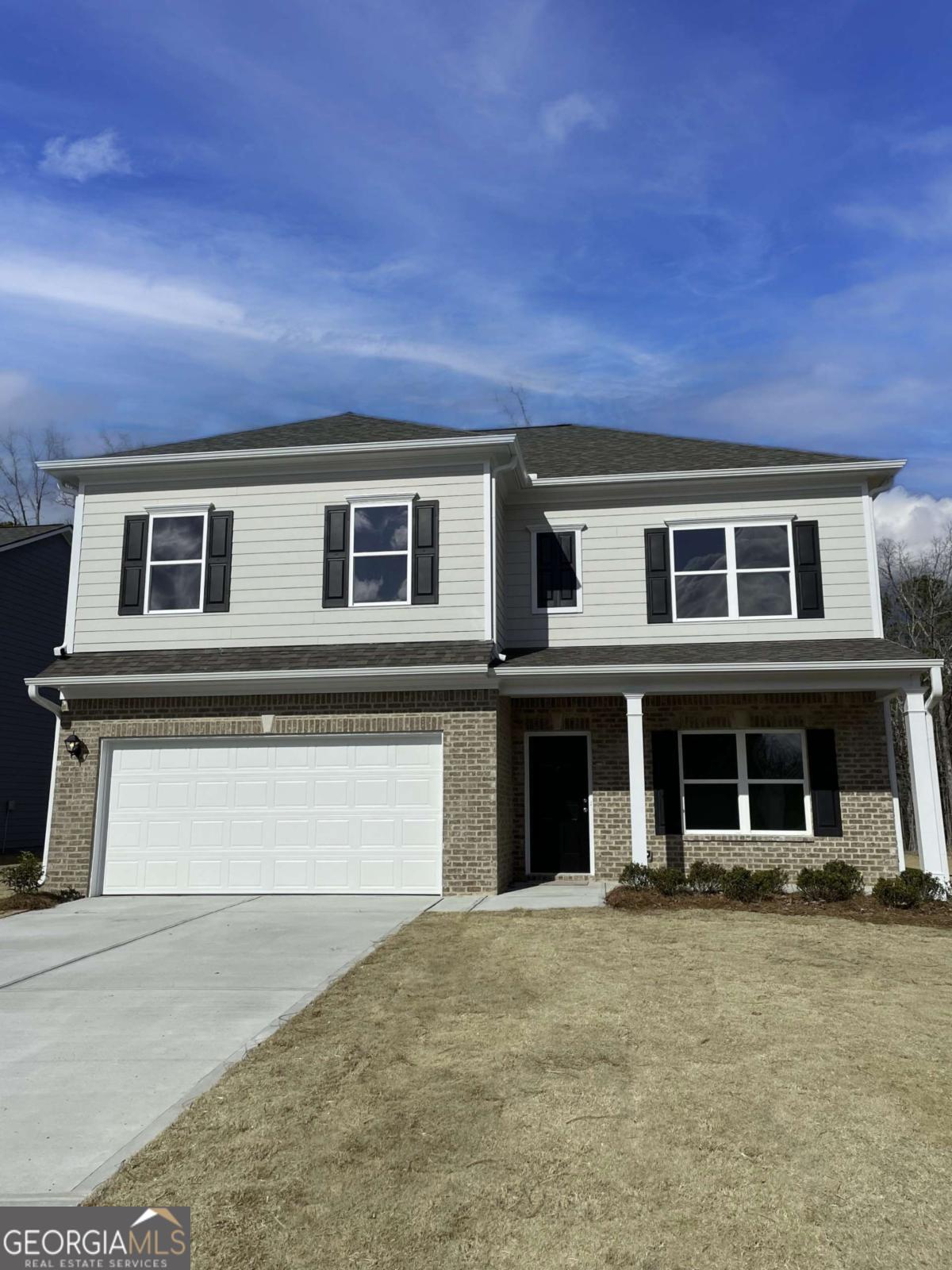 Investment Opportunity! This 4-bedroom, 2.5-bath home is currently leased for $2,500/month, with the lease expiring March 1. The main level features a kitchen with an island and seating, granite countertops, refrigerator, microwave, and electric range, all opening to the living room. A formal dining room-ideal as an office-and a half bath add versatility. Upstairs, you'll find four bedrooms and two full baths, including a spacious primary suite with a walk-in closet, double vanity, separate soaking tub, and shower. The second floor also offers a convenient laundry room and a flexible loft space. Call Jacob Calvert today at 706-591-8813 to schedule your private tour!