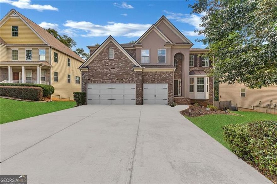 Welcome to 1913 Avondale Court - an elegant brick-front home nestled within the sought-after Heron Bay Golf Community. This impressive 4-bedroom, 4-bath residence offers over 4,000 square feet of finished living space plus a massive 2,000+ square foot unfinished basement, providing endless opportunities to expand, entertain, or create the retreat of your dreams.  From the moment you enter, you're greeted by a two-story foyer soaring over 20 feet high, accented by upper windows that bathe the home in natural light. The open-concept living room features rich hardwood floors and flows seamlessly into a formal dining room framed by elegant columns and a coffered ceiling, creating a show-stopping space for hosting gatherings.  The chef-inspired kitchen blends warmth and sophistication with granite countertops, stainless steel appliances, a large center island, and abundant cabinetry-perfect for casual breakfasts or preparing holiday feasts. Upstairs, a spacious loft area offers flexibility for a second living room, media space, or play area.  The primary suite is truly a retreat, boasting a massive layout with a fireplace and private sitting area, tray ceilings, and an abundance of windows. The spa-like ensuite features a soaking tub, dual vanities, and a separate shower for the ultimate relaxation experience. Three additional bedrooms and well-appointed bathrooms provide comfort and style throughout.  The home also includes a 3-car garage, expansive driveway, and an unfinished basement that's ready for your custom touch-home theater, gym, or guest suite potential.  Located in Heron Bay, residents enjoy resort-style amenities: a championship golf course, country club with restaurant and pro shop, multiple pools, tennis courts, lakeside walking trails, playgrounds, and a dog park. Conveniently close to shopping, dining, and the interstate, this home offers both luxury and lifestyle in one of Henry County's most desirable communities.  Don't miss the opportunity to make this exceptional property your own-schedule your private tour today and experience all that Heron Bay living has to offer.