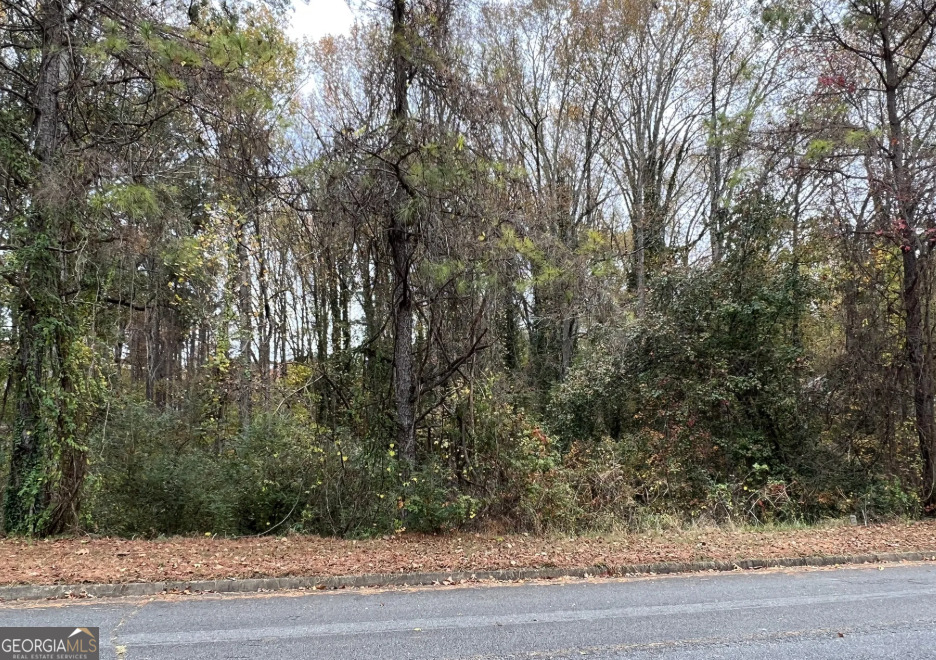 BACK ON MARKET WITH NO FAULT TO SELLER. Half acre lot available in Woodstock. Located near Bells Ferry and Hwy 92. Nicely wooded property. PERC test completed and will support septic system.
