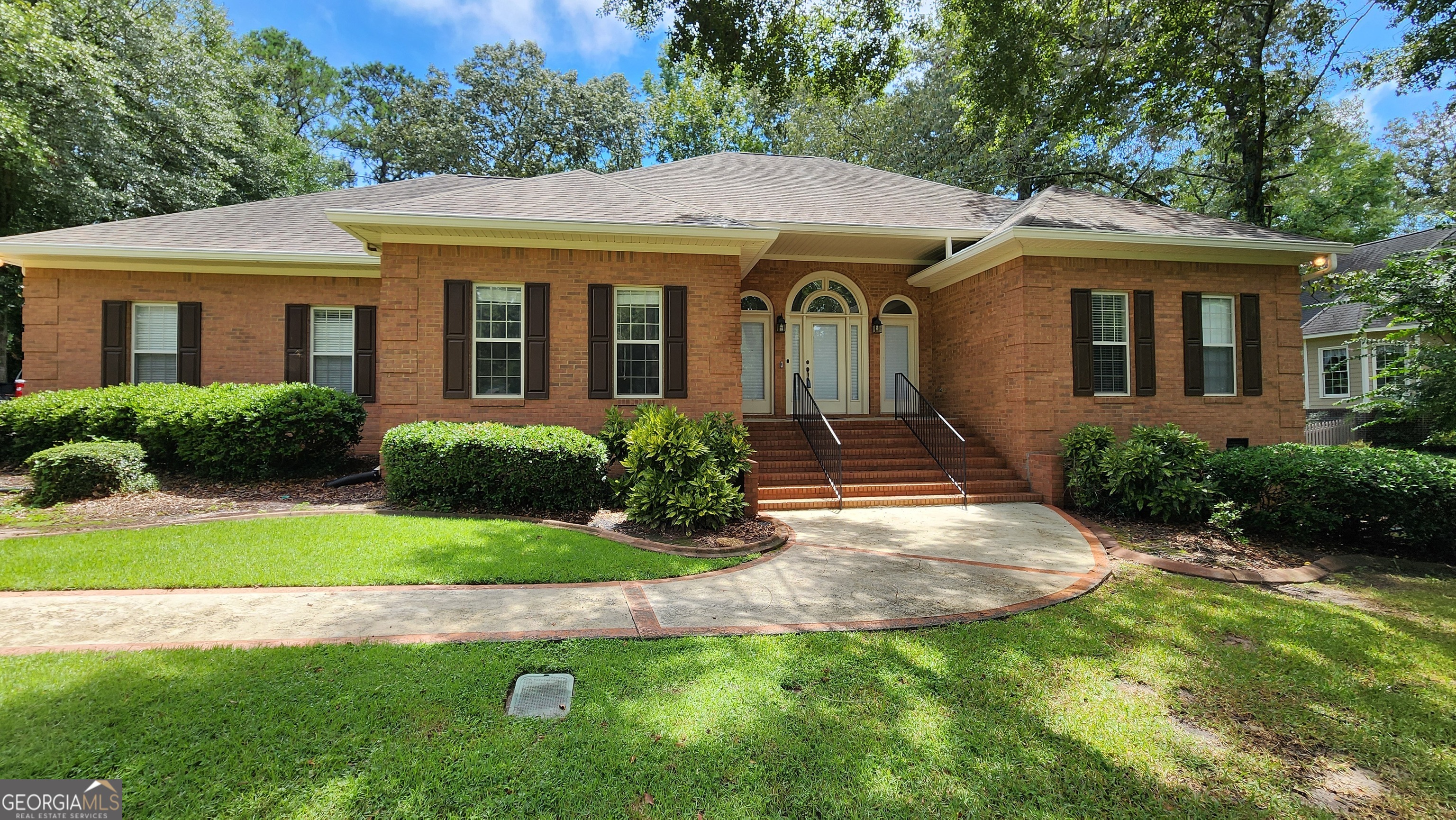 Discover this beautifully crafted 3-bedroom, all-brick home in the highly sought-after Stathams Landing golf course community. Offering an abundance of living space, this residence features two dining areas, a dedicated home office with built-in bookcases, and a spacious family room with a cozy gas fireplace. Two of the bedrooms share a convenient Jack-and-Jill bathroom, while the master suite boasts dual vanities, a custom-tiled shower, a soaking tub, and a generous walk-in closet. French doors open to a bright and inviting sunroom, where large windows frame serene views of the #2 Fairway. Sliding doors from both the sunroom and breakfast area lead to a deck overlooking the beautifully landscaped backyard. For outdoor entertaining, enjoy the brick-surrounded patio, perfect for morning coffee or evening cookouts. The property also includes an unfinished walk-in crawlspace basement with exterior access, and the farm-fenced backyard allows you to take in the golf course activity in comfort and style.