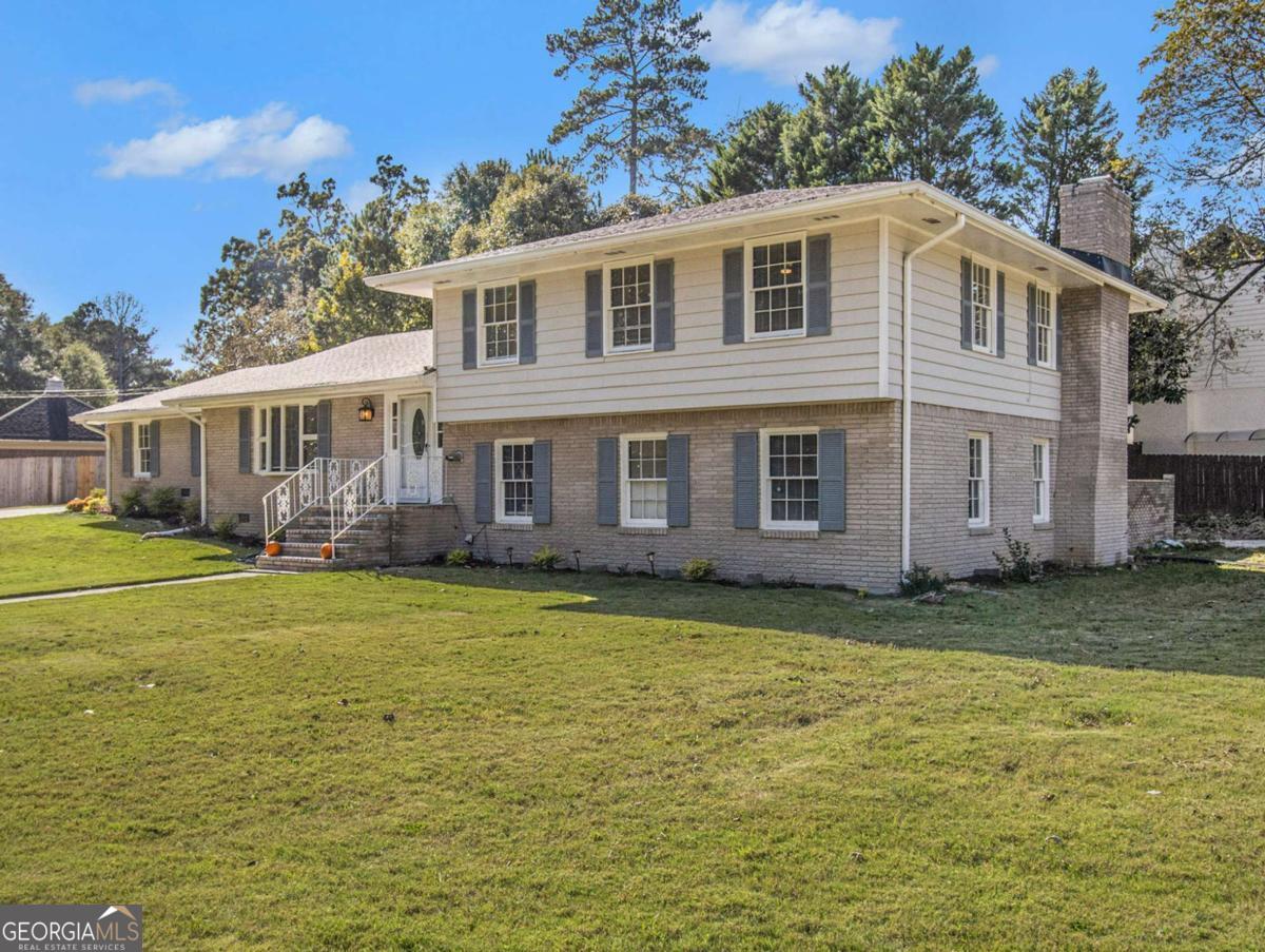 Beautiful ranch in the heart of Dunwoody, with a split level. Absolutely amazing living space with natural light on half an acre! Take 9 steps up where you will find 3 large Bedrooms and 2 full baths. Take couple of steps down from the kitchen and you will see the Fireside Living Room, as well as the fourth bedroom with a full bath, and the laundry room. Ideal location: Minutes to Dunwoody Village for restaurants and shopping, Perimeter Mall, and easy access to I-285, I-85 and GA-400. Close Proximity to hospitals: Peachtree Dunwoody Medical Center, Northside and Emory Saint Joseph, just to name a few.
