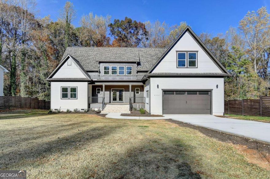 New Construction: Custom Modern Farmhouse in Sugar Hill    Experience modern living at its finest with this custom-built modern Farmhouse in the sought-after Duncan Town community of Sugar Hill, GA. Designed for both luxury and functionality, this two-story home with an unfinished basement offers a total of 6,051 of construction area on a spacious 0.69-acre lot - blending sophistication, energy efficiency, and natural charm. Well ranked schools and less than 10 minutes away from Downtown Sugar Hill, Downtown Suwanne, Buford City Hall and Lake Lanier.  The property has 4 Bedrooms, 4 Full Bathrooms, office or private room, massive bonus Room, Open-concept main floor with seamless flow for dining, cooking, and entertainment, massive kitchen island with jumbo quartz slab and private prep room with huge pantry.   Also, you will enjoy a wine bar and electric fireplace setup with gas outlet for future fire box, wood deck overlooking a serene, wooded backyard; premium asphalt shingles, High-ceiling, 2-car garage with EV charging outlet, wide long driveway, sidewalk for main entry, mud room and a Pet Shower Station for convenience. This 2025 home meets and exceeds fire, energy, and building codes, nationally and locally; a Certificate of Occupancy was issued by the city. The property has space to grow with a 1,250 sq. ft. of unfinished basement with built-in rough plumbing ideal for future integration or independent living.   Electric tankless water heater, low voltage panel for data and TV across 4 key locations, Radon gas system, and Pestban pest control system pre-installed with an outdoor receptacle for service, also James Hardie fiber cement siding & trims for long-lasting durability.  Large, cleared front yard with wooded privacy in the back, main entrance (12 ft. wide) in brick for a grand welcome. No HOA - enjoy freedom and flexibility. Very quiet old neighborhood and very low vehicle traffic. Lot has potential use for an Accessory Dwelling Unit (ADU) according to its size and public sewer.  Finally, the listing agent is the owner and licensed builder of the property, so negotiations and additions are made simple for the buyer.