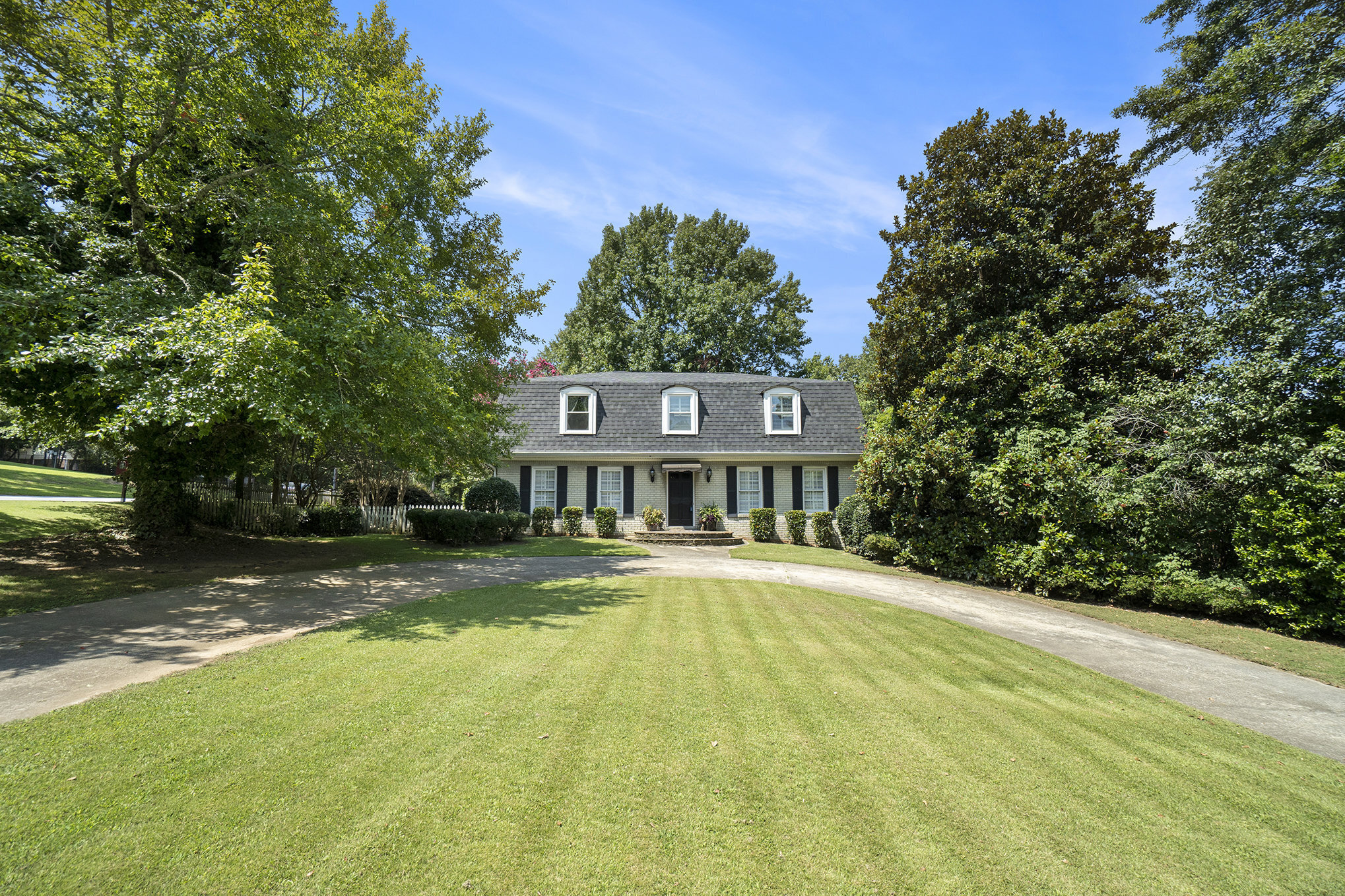 Beautiful Brookwood School District home in need of some repairs and upgrades. SOLD AS IS wonderful corner lot with lots of privacy and parking. Hardwood floors throughout, 3 fireplaces, 3 full baths, huge screened in porch, open deck, plantation shutters and a basement MAN CAVE with bar! Come view today.