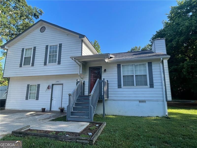 Outdoor enthusiasts, look no further. If you would like to be next to a fantastic park, have an above ground pool in your backyard, as well as an in ground trampoline, screened in back porch and a wooded backyard for privacy, you're going to love this deal. This wonderful split level home is located in a prime location in Adairsville across from Manning Mill park. With 4 bedrooms and 2 full baths, plus room for an office, playroom or whatever you'd like, there's plenty of room for all. The upper level has 3 bedrooms with 2 full baths.The main level offers a lovely family room with a wood burning fireplace. The kitchen is also located on the main and offers an eat in kitchen, pantry closet and access to back porch. On the lower level is another large bedroom with a large closet, a bonus room that could be an office, playroom, etc with an exterior door leading to the driveway. The laundry is laso on the lower level and is partially finished for half bath. There is also an outlet for a camper hookup.
