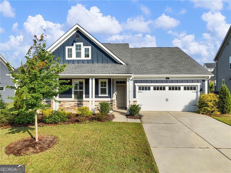 Perfect UPGRADED RANCH home in award-winning TWIN LAKES community! BETTER THAN NEW CONSTRUCTION W/ CUSTOM BLINDS AND FENCED YARD! Upon entering, you will notice the wide hallway with pristine LVP flooring and private office/ hobby room with glass doors in addition to the 3 bedrooms. This home boasts a spacious, bright, open-concept layout with a beautifully appointed kitchen. The kitchen is a chef's dream with shaker style 42" cabinets, soft-close cabinetry, a gas range, huge island with 3 pendant lights, sleek quartz countertops and subway tile backsplash all overlooking the family room and breakfast area- perfect for entertaining or cozy family gatherings. Extra LED lights in all bedrooms and family room. Plantation shutters throughout. Four storage closets. Master bedroom features lots of daylight and intriguing en-suite with luxurious FIVE FOOT WALK IN TILED SHOWER W/ DUAL SHOWERHEADS AND BENCH, dual vanities, quartz countertops, and oversized walk-in closet. CONVENIENT FLOORPLAN WITH MASTER FLOWING INTO MASTER CLOSET WHICH FLOWS IN TO LAUNDRY ROOM! Step outside into your LARGE, LEVEL, FENCED BACKYARD W/ COVERED PATIO featuring led lighting, speakers, & pre-wired for ceiling fan. Gates on both sides of home and Bermuda sod over entire yard. This home is located across the street from the vibrant community's lake! Other amenities include a pool, playground, fitness center, clubhouse, and dog park, making it a perfect place for a lifestyle of leisure and convenience. Brand new shopping nearby!