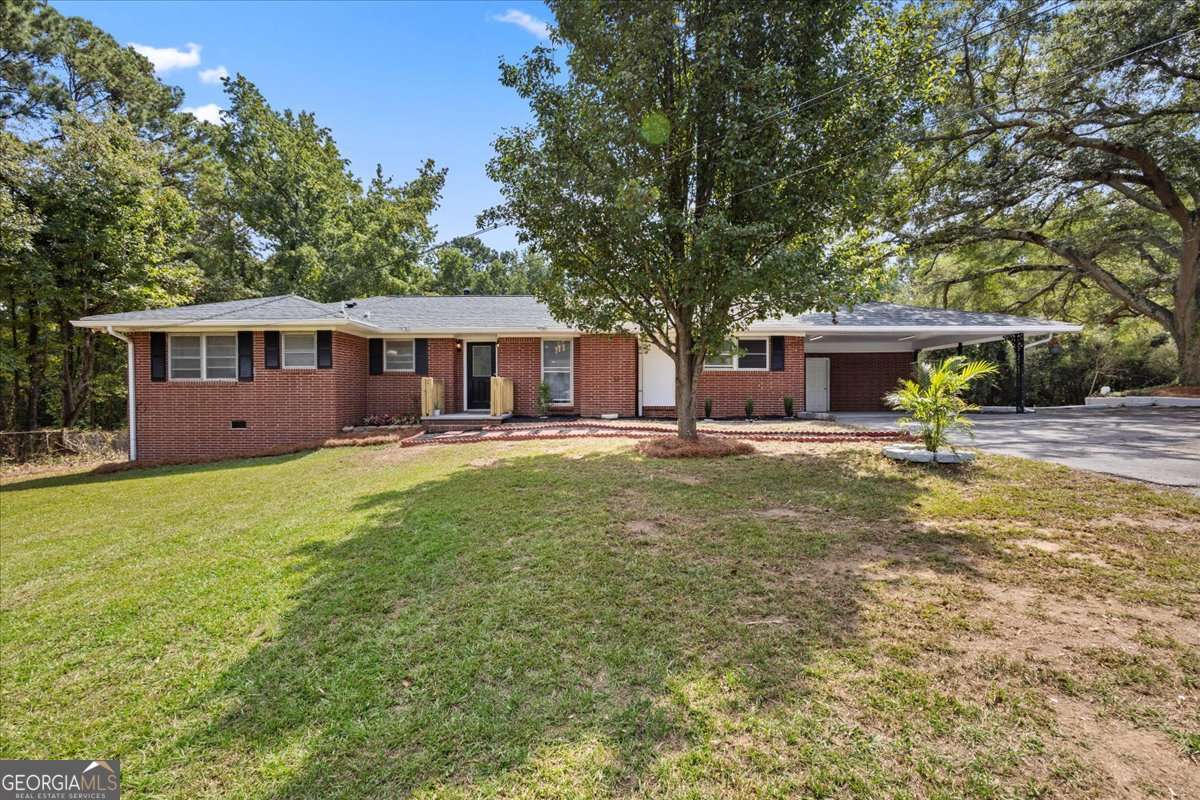 Welcome to this beautifully updated Douglasville home situated on a generous 2.2-acre lot. This property offers the perfect balance of modern updates, usable land, and convenience. Fresh interior paint and new laminate flooring create a clean, inviting atmosphere, while a brand-new roof ensures long-term peace of mind. The exterior has been cleared, giving the land a spacious and open feel with plenty of potential. The kitchen has been fully renovated with quartz countertops and modern finishes, providing both style and functionality. One bathroom has also been thoughtfully remodeled with contemporary details. In addition, the property features a large storage building, perfect for tools, hobbies, or additional space to fit your needs. Located just minutes from I-20, shopping, dining, Downtown Douglasville, and Lionsgate Studios, this home is move-in ready and offers a rare combination of updates, land, and location. Don't miss the opportunity to make it yours.