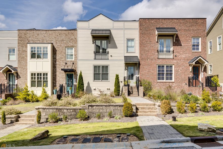 Beautiful Rooftop Terrace Townhome located in Downtown Historic Norcross. Custom board & batten up entryway, Quartz in kitchen and ALL baths, 42" kitchen cabinets w/upper glass-front cabinets to ceiling, under cabinet lighting, stainless farmhouse sink! Hardwood floors thru-out main living area, wood stair treads from entry level to main living level, tile in ALL baths including shower floor & shower walls, frameless glass shower surround in owner's suite,  5" crown molding thru-out main living level, 9' ceilings all 3 levels, 10x10 storage closet off rooftop terrace, covered deck with open-air grilling area. Walking distance to active downtown area with shops, restaurants, parks, concert series, seasonal festivals & more!