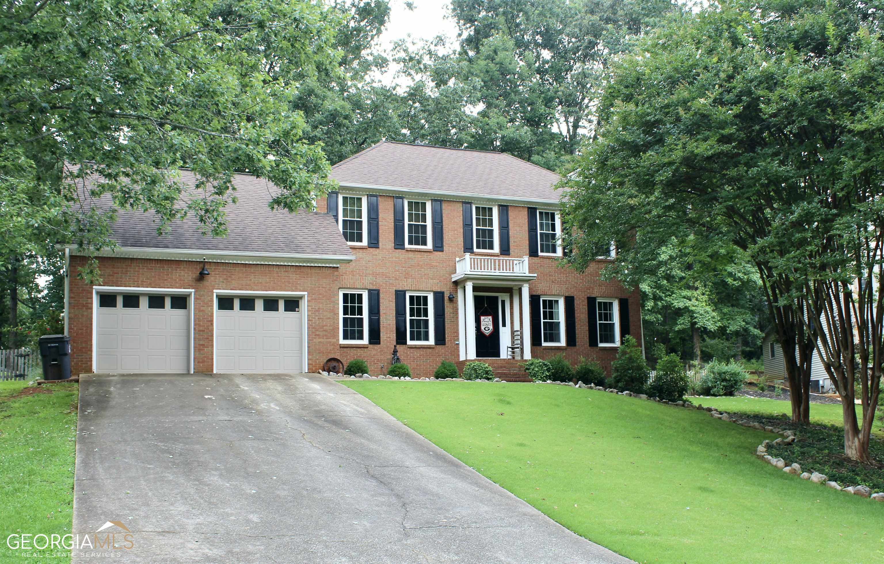 This beautiful, traditional two story home is a must see! Situated on a gorgeous wooded lot, that spans almost an acre. Conveniently located to the city, yet still quiet and peaceful. Beautiful hardwood flooring throughout the home. The kitchen has gorgeous countertops and updated stainless steel appliances. This home also features a spacious living room, with a beautiful stone fireplace. A nice formal dining room perfect for entertaining as well as an updated half bath on the main level. You walk out the back to a huge covered deck, overlooking a well established landscape. Located upstairs are 3 bedrooms and 2 full bathrooms. The master bedroom features a nice sized walk-in closet. You will also find a spacious bonus room above the 2 car garage. This would make for a nice office, or game room. This home is waiting for you!