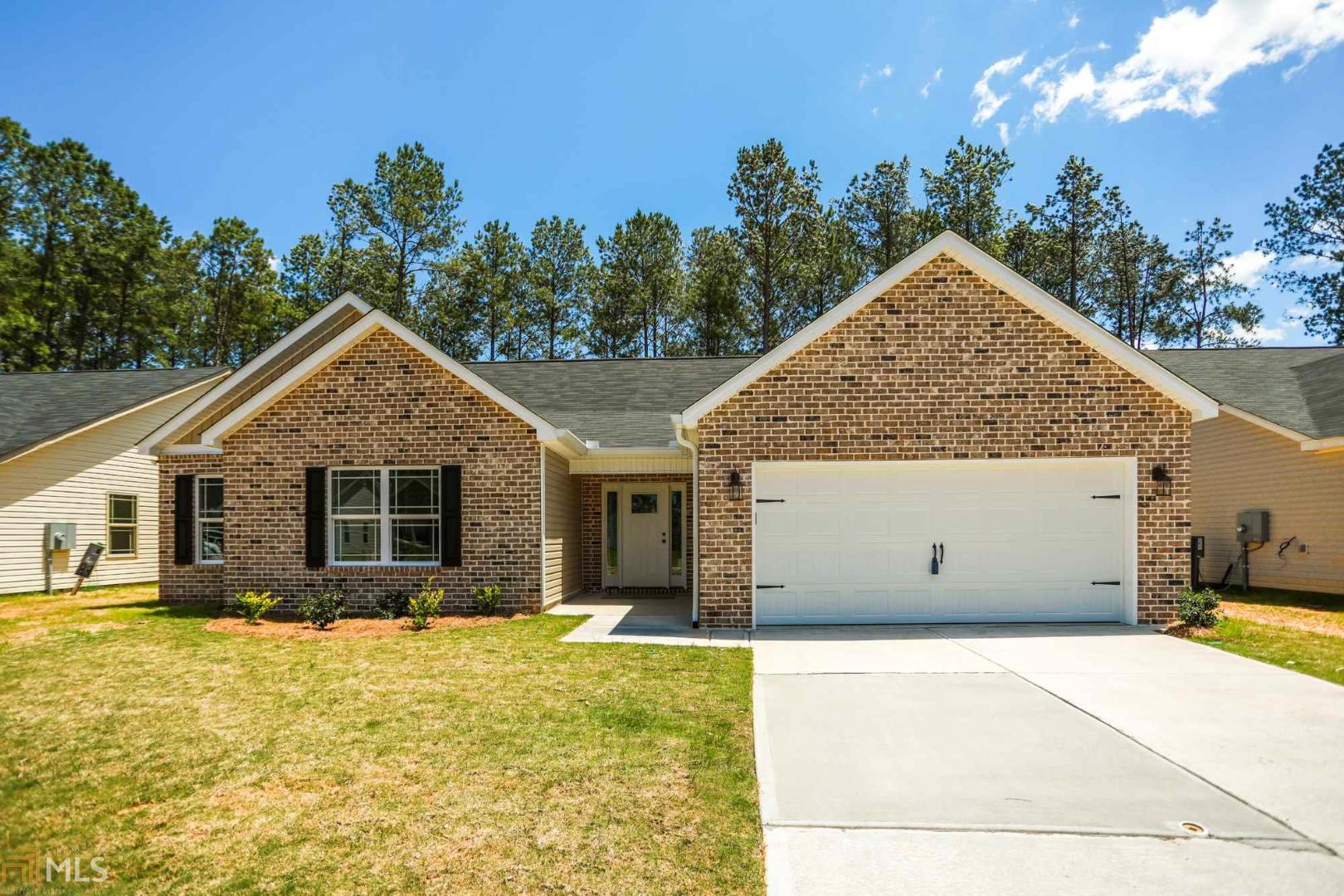 New construction 1 level home with brick front and an open floor plan, 4 bedrooms, 2 baths, very efficient layout, spacious layout, includes granite, tile backsplash, tile bathrooms and laundry, with hardwood floors throughout!