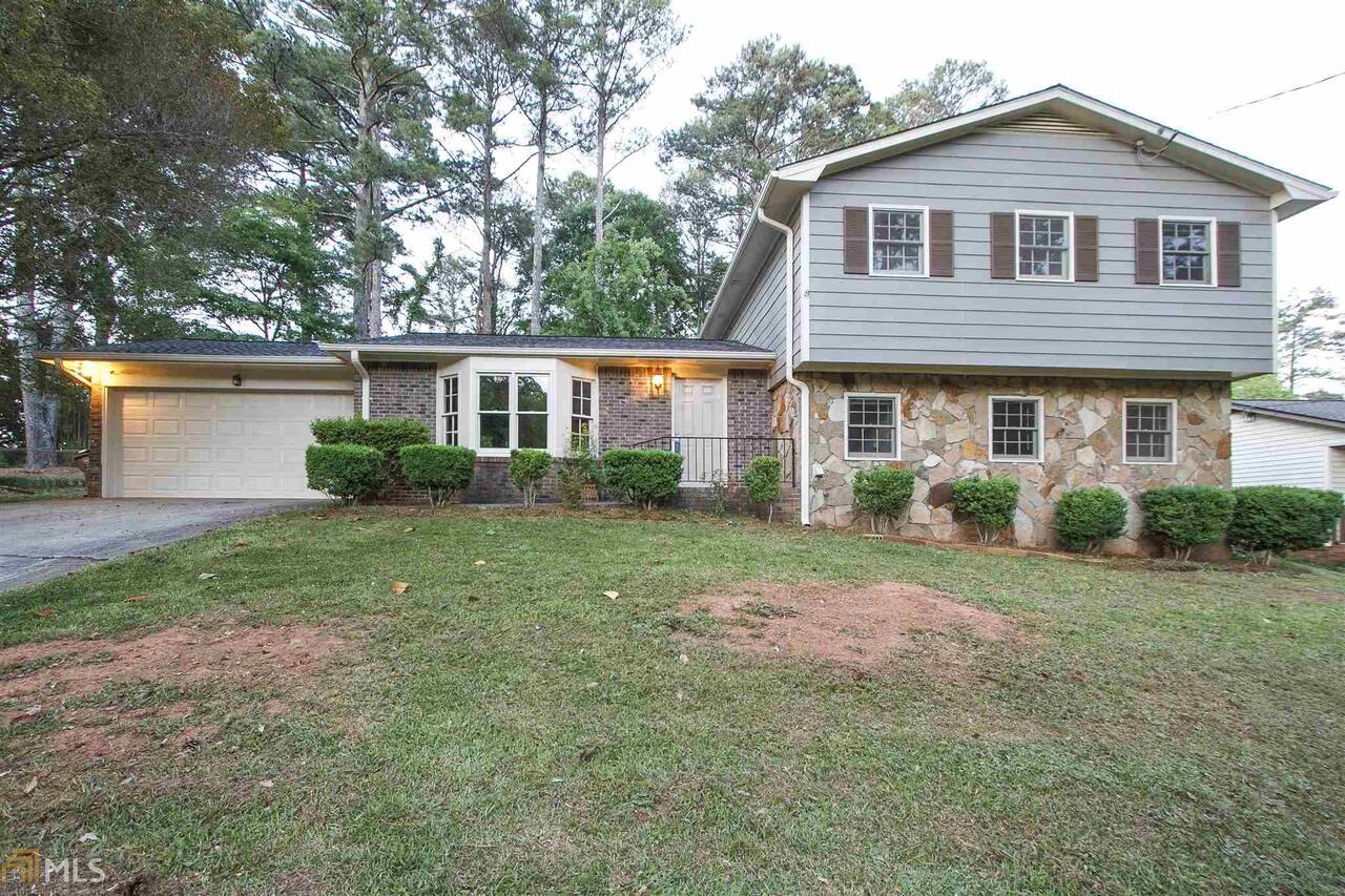 Step into this perfect split level home in the heart of Norcross, Georgia. Rich color on the exterior and Welcome guests to your formal dining room and living room plus entertain in the large great room with cozy fireplace. Brand new interior paint make these spaces ready for your artwork and decorating touches! The bright cheerful kitchen and sunny breakfast room overlook back yard. Downstairs you will find a large fourth bedroom or flex space for playroom, office, or guests. The two car garage just clean and painted with new car garage opener. Fenced backyard.
