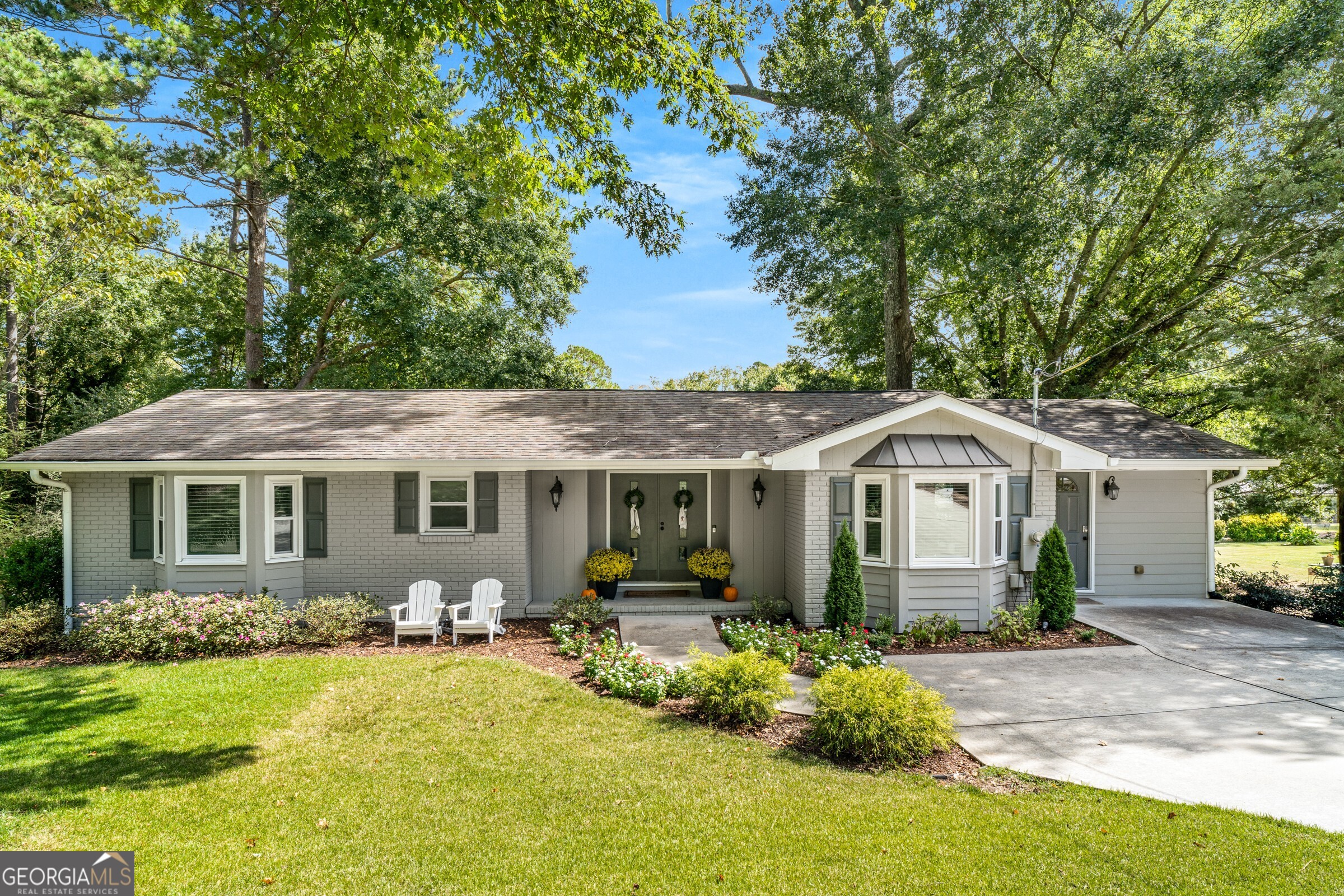 Fantastic turnkey property in Sandy Springs - move right in! This 3BR/2.5BA features open concept living with the kitchen island opening up to a dining area and large primary living room. An oversized conditioned sunroom, multiple decks, firepit, and basement all make this home perfect for entertaining. The two secondary bedrooms are jack-and-jill with ample closets, and the primary is en-suite with a large closet and private bath. The unfinished basement boasts an incredible amount of storage for a home of this size. Very well upkept inside and out, you'll enjoy a large private backyard in a very flat walkable neighborhood with friendly neighbors. This is also one of the only homes on this side of the street that is connected to public sewer instead of septic. In the area, you'll love Abernathy Park with a great playground, City Springs with excellent restaurants and entertainment, very commutable to Buckhead, Midtown, or Alpharetta via GA400.