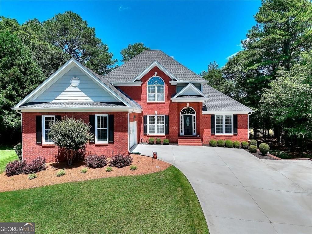 Welcome to a stunning real estate opportunity that promises to captivate you from the moment you arrive. As you step inside, you are greeted by a spacious entranceway. The flow of natural light throughout this home creates an uplifting vibe. The living area is central in the house and allows for a cozy evening with loved ones. Adjacent to the living area is the large open kitchen, complete with stainless steel appliances and granite counter space. The master bedroom is on the main living level with an en-suite bathroom with an oversized shower and garden tub. Laundry room is on the main living level along with a half bath off the kitchen. Upstairs are 3 additional bedrooms. Full finished basement with exterior entry with the possibility of a 5th bedroom or office, media room, living area and full bathroom. All new windows and gutters throughout, 16x20 screened porch built in 2015, new driveway in 2018, hardwood floors refinished in 2025. Everything about this home speaks to quality and care, making it a place you will be proud to call your own. This beautiful home is truly move-in ready!