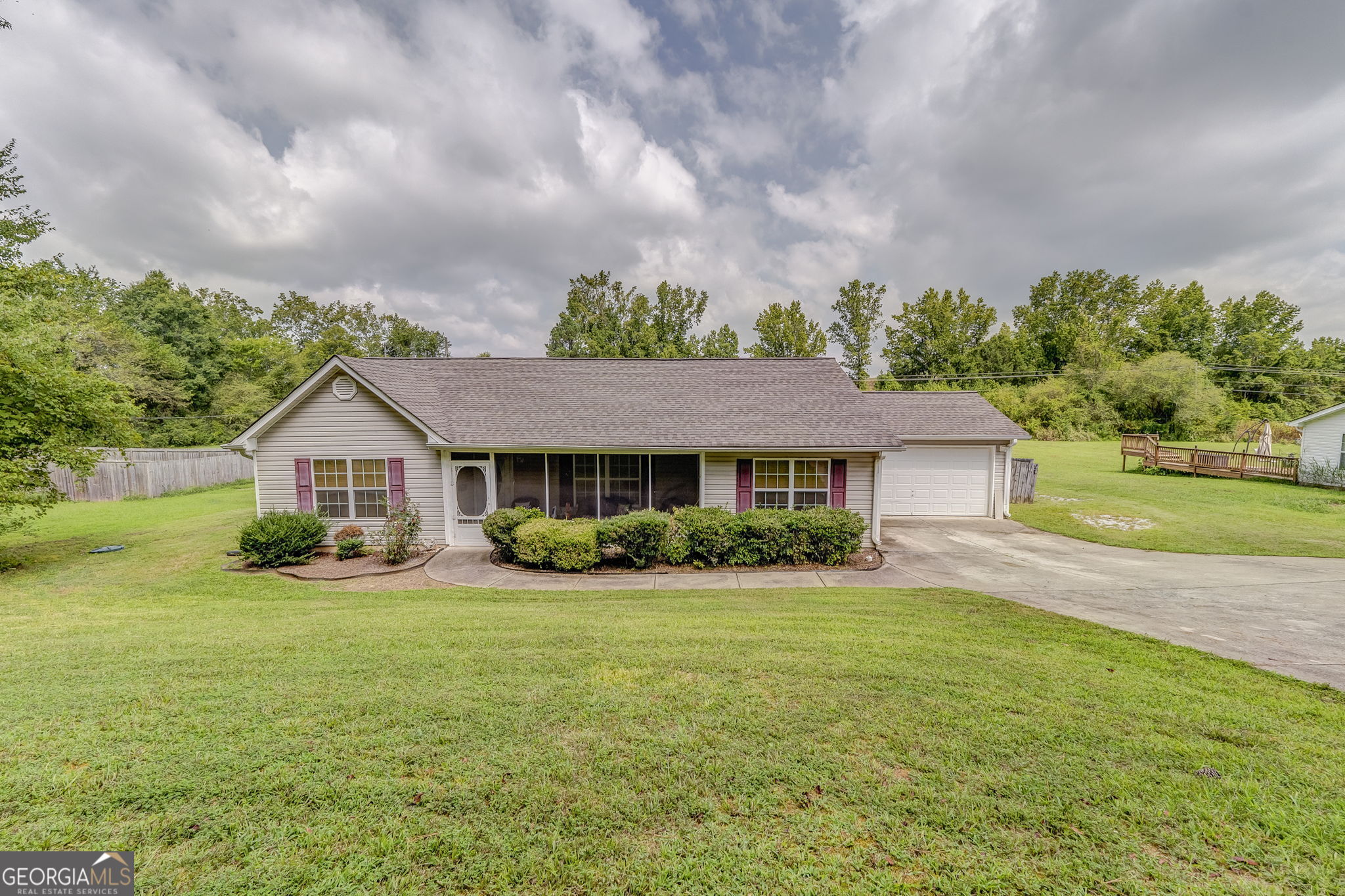 Located in the Lake Creek area of Cedartown, this 3 bedroom, 2 bathroom home features an open floor plan with high ceilings on a slab foundation. The living, dining, and kitchen areas flow together for everyday convenience, while the screened porch and large back deck extend the living space outdoors. A fenced backyard and attached garage add function and storage. Convenient to Rome and Cartersville, this property is move-in ready.