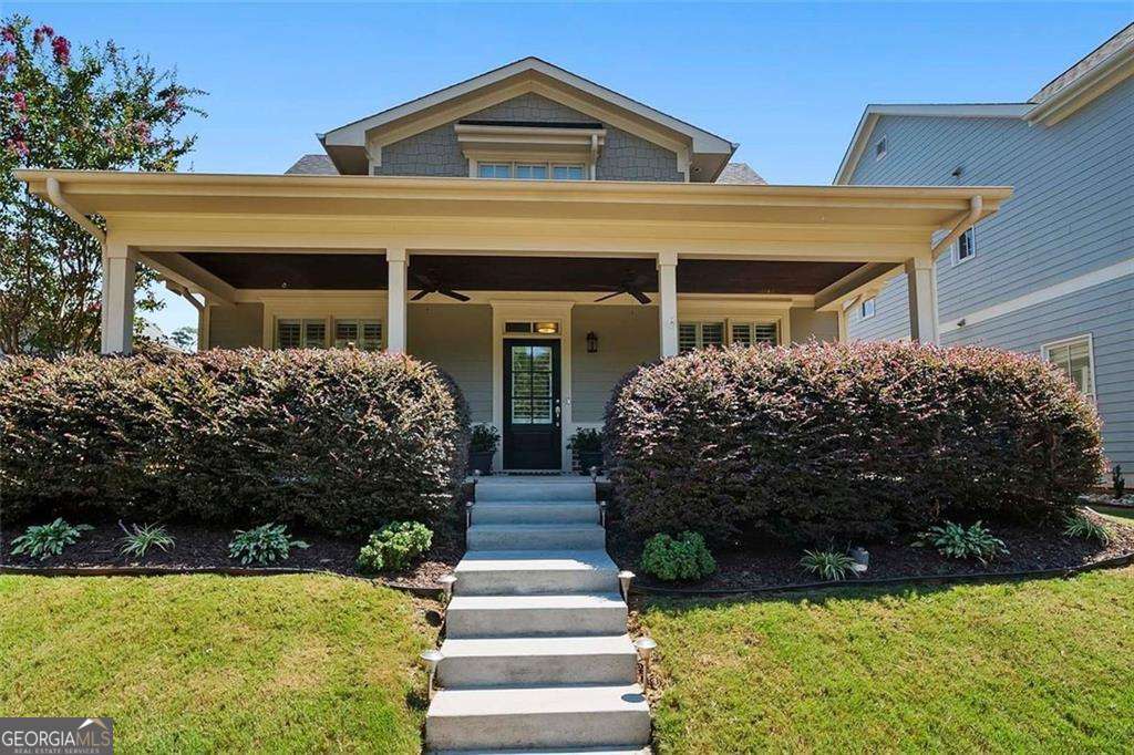 This beautiful 4-bedroom, 3-bath home close to the square in town offers the perfect blend of comfort and convenience. Located in a quiet neighborhood just minutes from the Historic Covington Square and the scenic Cricket Frog walking trails, you'll love being close to shopping, dining, and outdoor recreation. Step inside to find a freshly painted interior and lots of natural light. This thoughtfully designed floor plan has two bedrooms on the main level, including a spacious primary suite with a walk-in closet and a large separate tile shower and soaking tub. The main floor also features a separate dining room and an open-concept kitchen and living area, ideal for entertaining or enjoying cozy nights at home. The kitchen boasts stainless steel appliances, a nice-sized pantry, and plenty of counter space. The laundry room is on the main floor and offers cabinets for storage and a sink. Upstairs, you'll find two additional bedrooms, a full bathroom, and a huge bonus room-perfect for a playroom, home theater, or office. There's also abundant storage throughout the home. Enjoy morning coffee on your covered front or rear porch. Two-car garage in the rear of the home helps with curb appeal. Looking for recreation? The neighborhood has plenty of walkable sidewalks and you are just minutes from the local Cricket Frog Trail that winds thru Covington. Don't miss this chance to own a home that combines modern comfort with Covington's timeless charm.