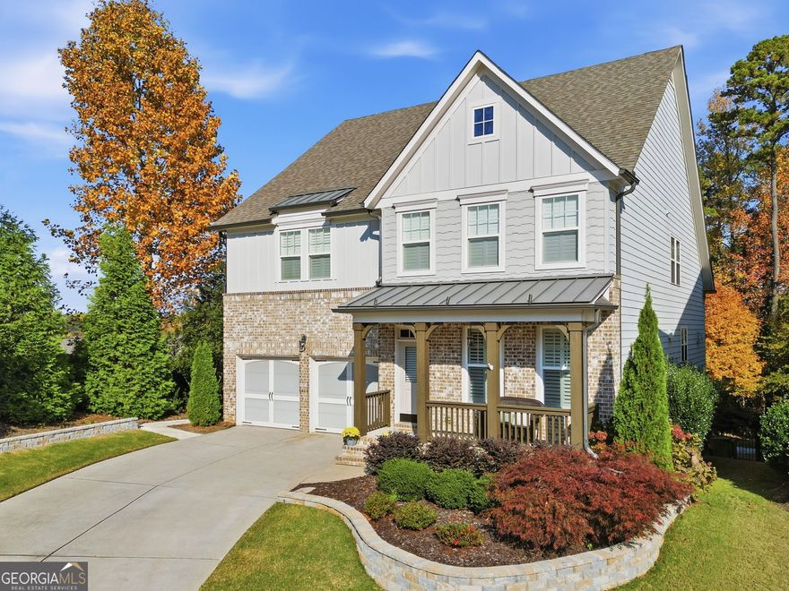 MOTIVATED SELLER! Welcome to this Hard-to-Find 5 BR/4.5 BA home with a MASTER ON MAIN situated on a premium cul-de-sac lot! Special features incl., a Welcoming front porch, 2-story family room w/stacked-stone fireplace, built-in bookcases/cabinets, plantation shutters, finished basement, and high-end epoxy- finished garage floor. The spacious Island Kitchen, perfect for entertaining, features beautiful granite countertops, custom cabinets, and a custom walk-in pantry complete with a wine refrigerator. The formal dining room is currently being used as an office.  The upstairs loft/flex space w/built in cabinets is perfect for home schooling, art studio, or kids' hangout. There are three large bedrooms upstairs, each with a walk-in closet. A Jack and Jill bath and one bdrm w/it's own private bath. The finished basement includes a media room, game room, workout room, full bath, and a large unfinished room for extra storage. Basement is also plumbed for a bar or second kitchen. You will love the extended oversized deck and covered patio (w/dry underdecking), and the level/fenced backyard that backs up to green space. Neighborhood amenities include a pool, playground, pavilion w/grill, and fun community events. Convenient to I-575, Downtown Woodstock and Roswell. Located in top school districts, including "Blessed Trinity" and "River Ridge", this home is sure to impress! Call today for a quick showing.