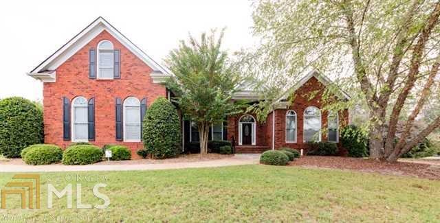 Move-In-Ready, 4-sided brick traditional beauty! Gorgeous crown moldings, 10 ft ceilings-vaulted in LR and MBR. 3 spacious bedrooms on main level incl. MBR w/luxurious bath, large dbl shower & spa tub. 4th bedroom w/full bath is secluded above garage. Large bright kitchen w/breakfast room overlooking level wooded yard, separate dining. All season sunroom and freshly painted deck with bench for entertaining. Full basement is framed for finishing.