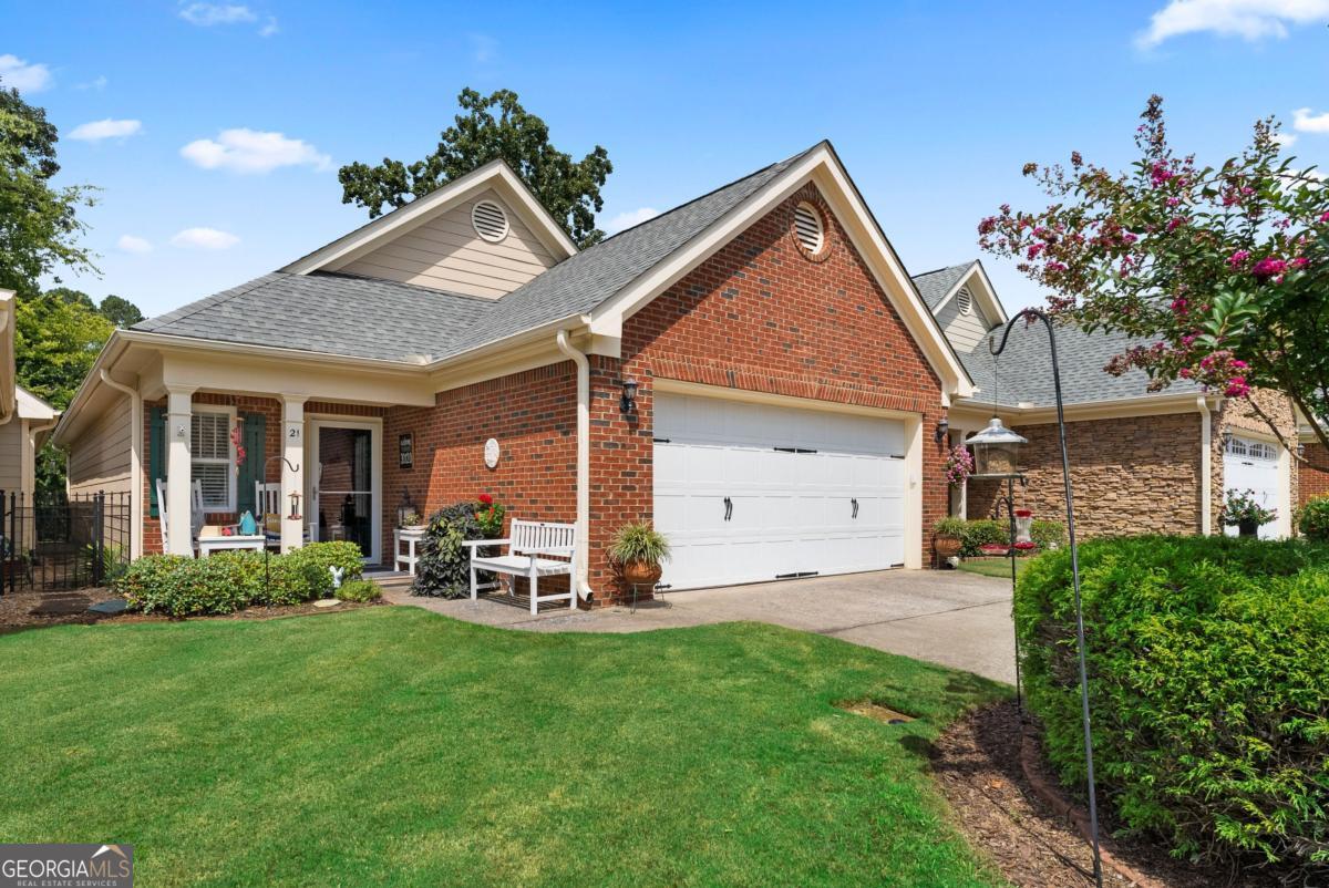 Welcome to this one of a kind 2 bedroom, 2 bathroom home in This Villas at Pine Grove! The upgrades such as quartz countertops, LVP flooring & fresh paint all throughout, custom bookshelves, and new appliances and toilets. It also features a sunroom, patio, and sitting area in the back yard! Move-in ready & BEAUTIFUL!