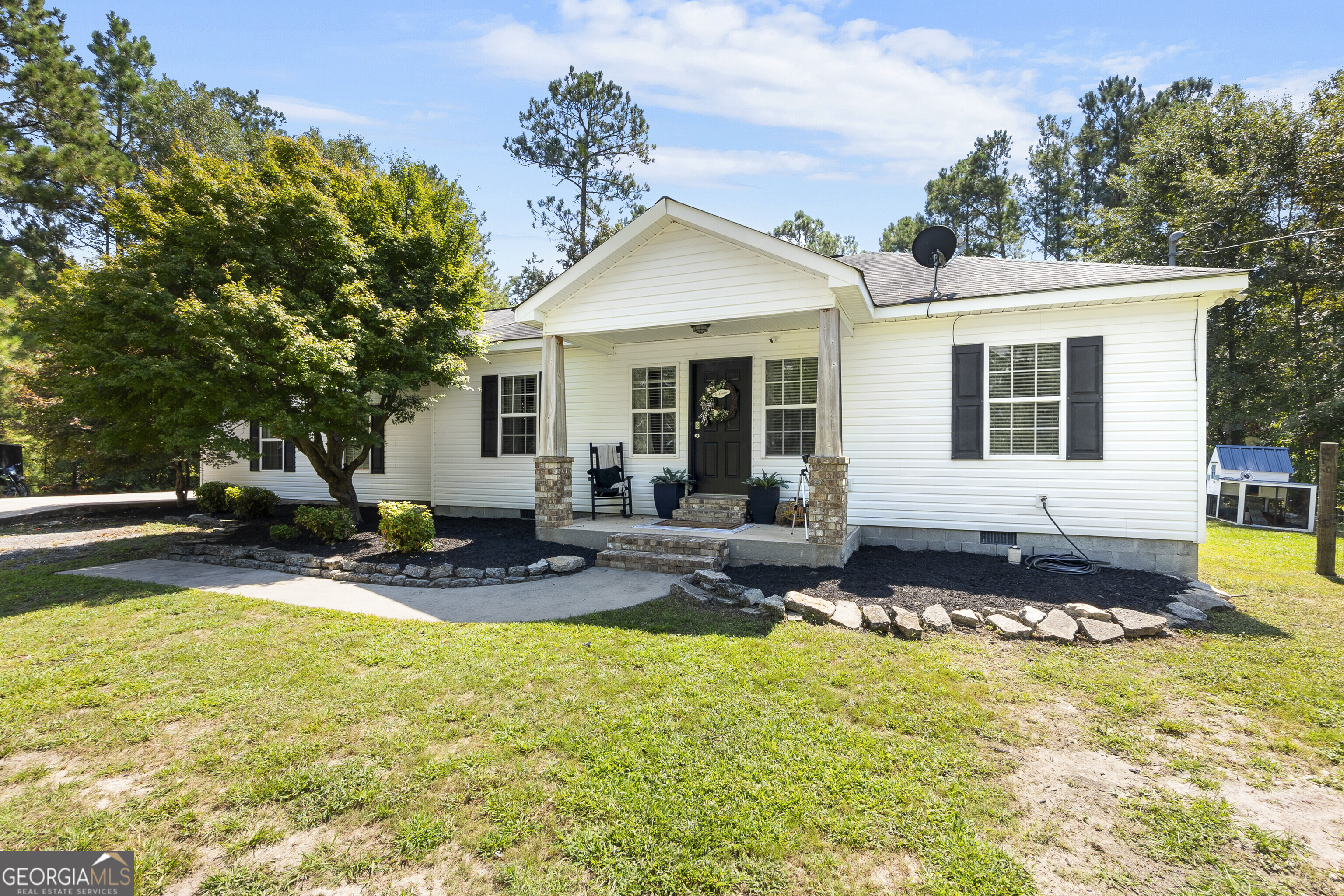 Welcome to this spacious 4 bedroom, 3bath home nestled on over 2 acres inPeach County, offering the perfect blend of comfort, functionality, and outdoor living. Step into a cozy living area with bedrooms close by, where two secondary bedrooms share an updated hall bath. The spacious owner's suite includes a dressing area along with shower. The kitchen features a smooth-top stove, an eat-in area, and a window overlooking the backyard. An additional living area provides even more entertaining space, complete with cabinetry, countertops, a full bedroom, and a bath. This area also offers two separate entrances leading to the backyard or a side concrete pad.Outdoors, enjoy a covered patio and an inground pool, perfect for relaxing or hosting gatherings. A metal workshop with lean-to sits on a concrete pad, offering excellent space for projects or storage. All of this is situated in PeachCounty on over 2 acres, combining indoor comfort with outdoor amenities.Listing agent related to seller.
