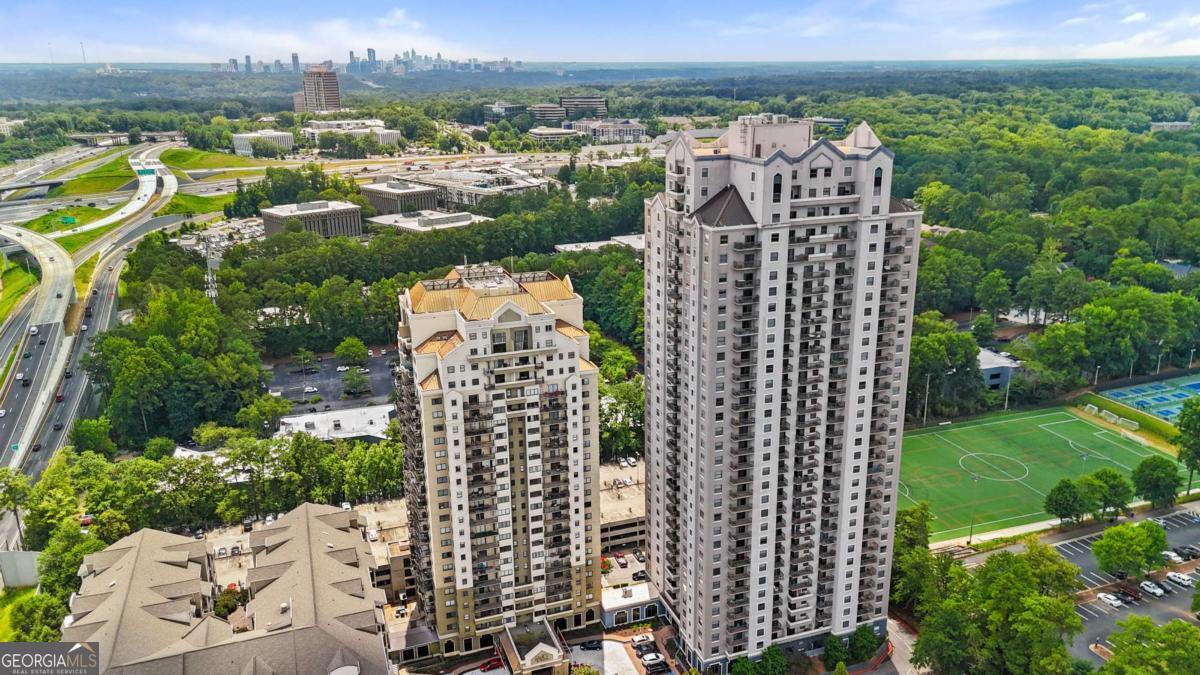 ATTENTION PROFESSIONALS AND DOWNSIZERS! EXCELLENT LOCATION, SECURITY AND AMENITIES! BRAND NEW HVAC SYSTEN AND HOT WATER HEATER! THIS FRESHLY PAINTED CONDO FEATURES A ROOMMATE FLOOR PLAN INCLUDING GENEROUSLY SIZED BEDRMS WITH DOUBLE CLOSETS IN ONE BDRM AND WALK-IN CLOSET IN THE OTHER BDRM, SEPARATE BATHROOMS, BEAUTIFUL BAMBOO FLOORS THROUGHOUT, TONS OF NATURAL LIGHT, DOUBLE BALCONIES, TWO DEEDED PARKING SPACES AND STORAGE UNIT, WASHER AND DRYER, ALL APPLIANCES INCLUDED. HOA Dues cover WATER, SEWER, TRASH, AMENITIES. PREMIUM AMMENITIES: 24-Hour CONCIERGE, RESORT-STYLE POOL, FITNESS CENTER WITH PELOTON BIKES, DOG PARK, GRILL AREA, PLAYGROUND, ON-SITE MARKET, DRY-CLEANING/ALTERATIONS, TOP-TIER SECURITY. CLUBHOUSE IN THE EVA BLDG. CAN BE RESERVED FOR PARTIES AND FAMILY GATHERINGS. CENTRALLY LOCATED, minutes to GA 400 & I-85, AIRPORT, GA TECH, WALK TO MARTA TO ARRIVE IN DOWNTOWN HASSLE-FREE, CLOSE TO PREMIER SHOPPING, PERIMETER MALL, WHOLE FOODS, AND DINING. WALK THROUGH THE CONNECTED ENTRANCE TO HAMMOND PARK with TENNIS, BASKETBALL, SPORTS FIELDS. MINUTES TO CITY SPRINGS THEATER and CITY GREEN LIVE with FREE OUTDOOR CONCERTS. VIBRANT COMMUNITY WITH SOCIAL EVENTS. COME ENJOY TROUBLE-FREE, UPSCALE LIVING at a VALUE PRICE!