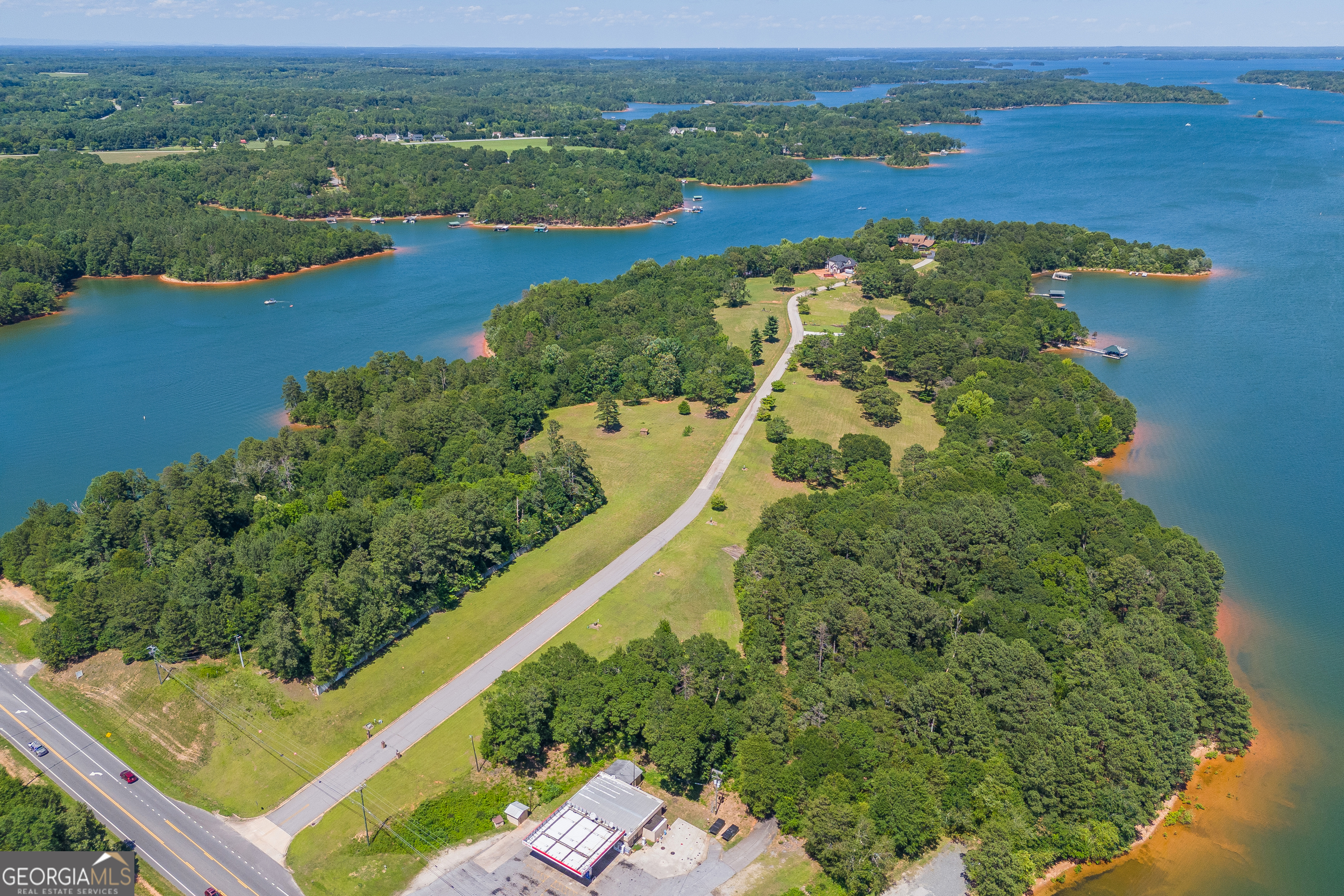 Prime Lakefront Development Opportunity on Lake Hartwell, GA!  Phase II of The Peninsula!  Are you ready to seize a golden opportunity in one of Georgia's most picturesque locations? We present a rare and exciting chance to develop a premier lakefront property on our beautiful 55,900 acre lake. This exceptional parcel offers ENDLESS possibilities for visionary developers and entrepreneurs alike. Imagine transforming this picturesque property into a lakeside restaurant where diners can savor delicious meals while enjoying breathtaking views of Lake Hartwell. For those with a vision for waterfront recreation, there's ample room and potential to build a courtesy dock and a 26-slip community dock, providing easy access to boating and water activities.  Lake Hartwell is renowned for its stunning natural beauty, recreational opportunities, and welcoming community. With its clear blue waters, scenic surroundings, and abundant wildlife, it's a perfect backdrop for any development. The lake is a popular destination for fishing, boating, and relaxation, drawing visitors year-round.  This prime location offers not only a picturesque setting but also the potential for significant business growth and community impact. Seize this unique opportunity to create a lasting legacy in Lake Hartwell. Contact us today to explore how you can bring your vision to life in this idyllic lakeside location!    City Utilities - Water & Sewer.