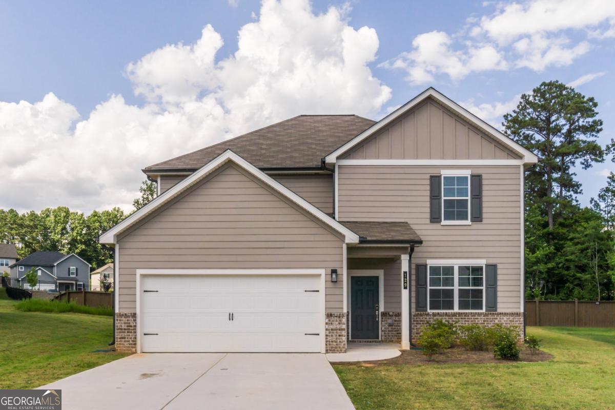 Move-In Ready 4BR/3BA Home in Dawson Grove! Welcome to this beautifully maintained 4-bedroom, 3-bathroom home located in the desirable Dawson Grove subdivision. Built in a recently established community, this two-story home offers a spacious open-concept floor plan, ideal for comfortable living and entertaining. The main level features a welcoming entryway that opens to a large great room with a fireplace and a stunning kitchen complete with a generous central island, granite countertops, and stainless steel appliances. The kitchen overlooks the dining area and living space, creating the perfect flow for gatherings. A walk-in pantry, mudroom, and coat closet are conveniently located just off the kitchen, leading to the attached two-car garage. Also on the main level is a guest bedroom with a spacious closet and an adjacent full bathroom-perfect for visitors or multi-generational living. Additional storage includes a linen closet and extra coat closets. Sliding glass doors off the dining area open to a back patio with partial privacy fencing and no rear neighbors. Upstairs, you'll find two secondary bedrooms (one with a walk-in closet), a full hall bathroom, a large loft ideal for a home office or media room, and a laundry room. The spacious primary suite features a 5-piece en-suite bathroom with dual vanities, soaking tub, separate shower, and a walk-in closet. Conveniently located near top-rated schools, GA-400, and the North Georgia Premium Outlets. Enjoy close proximity to shopping, dining, medical facilities, and entertainment. Outdoor enthusiasts will love being minutes from Lake Lanier, Amicalola Falls, Atlanta Motorsports Park, hiking trails, parks, and more. Easy access to destinations such as Dahlonega, Helen, Cleveland, Blue Ridge, and the North Georgia mountains-plus numerous local wineries and recreational activities-all within an hour's drive. Don't miss the opportunity to own this fantastic home in a prime location