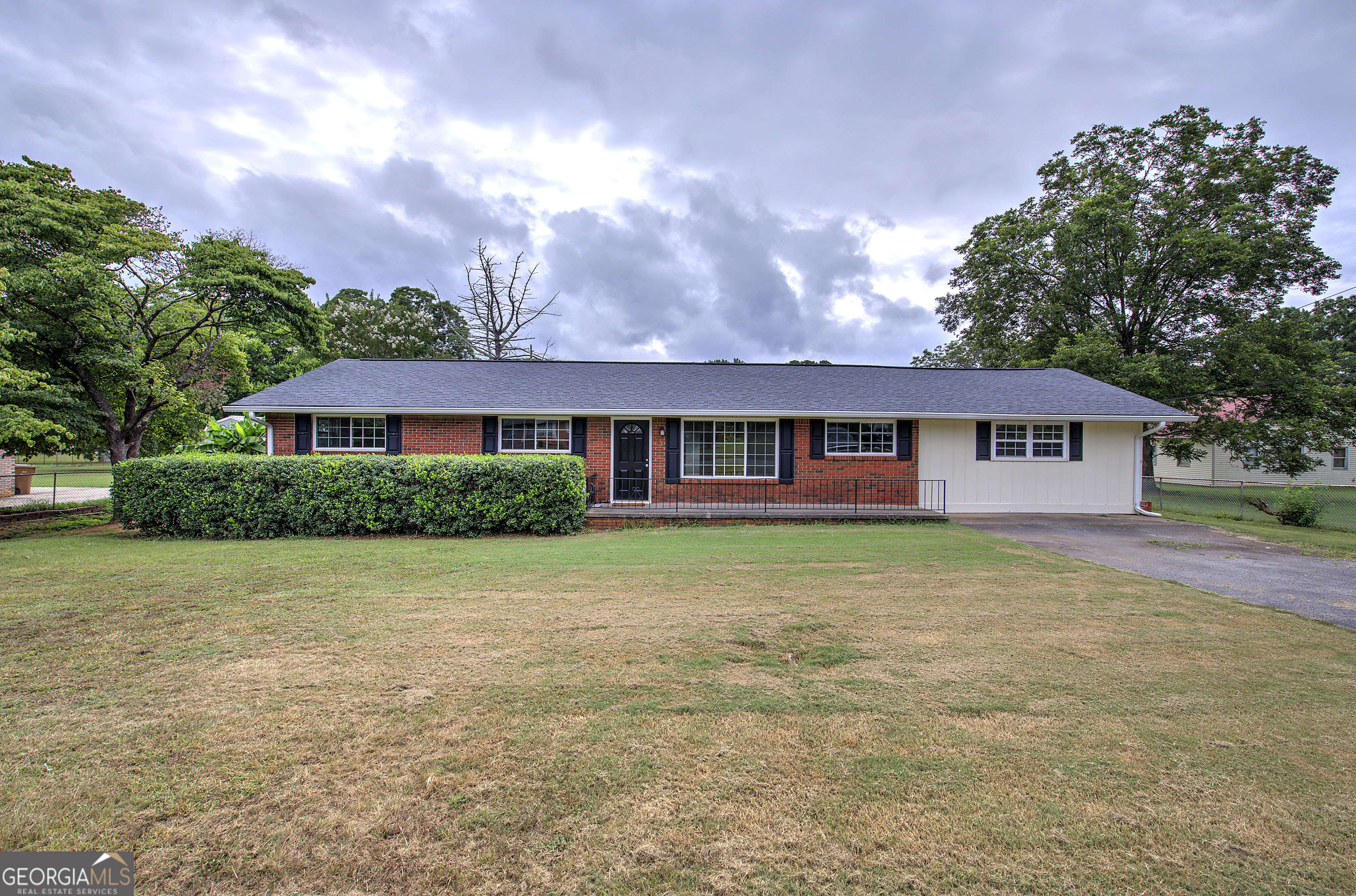 In search of a stepless ranch in Cartersville? This lovely home may be just what you're looking for. Available now is this four sided brick ranch with a split bedroom plan that includes 4 bedrooms and 2 full baths. As you come in the front door you enter the large Great room with enough space to include a dining area if needed, as well as, access to the back patio and fenced backyard. To the left of the Great room are 3 bedrooms with hardwood floors, ceiling fans and good size closets. The hall bath has a tub/shower combination; a vanity with NEW granite countertops, lighting, mirror, and flooring. On the opposite side of the house is the BRAND NEW KITCHEN with ALL NEW CABINETS and granite countertops. There is a ton of pantry space and a breakfast area. The kitchen also has NEW flooring and oven. A large primary suite is located just beyond the kitchen with two closets and a full bath. The bath has a tub/shower and a new vanity. This fantastic home has great square footage, a level fenced yard and is in the Cartersville city limits. Don't miss out on this great buy.